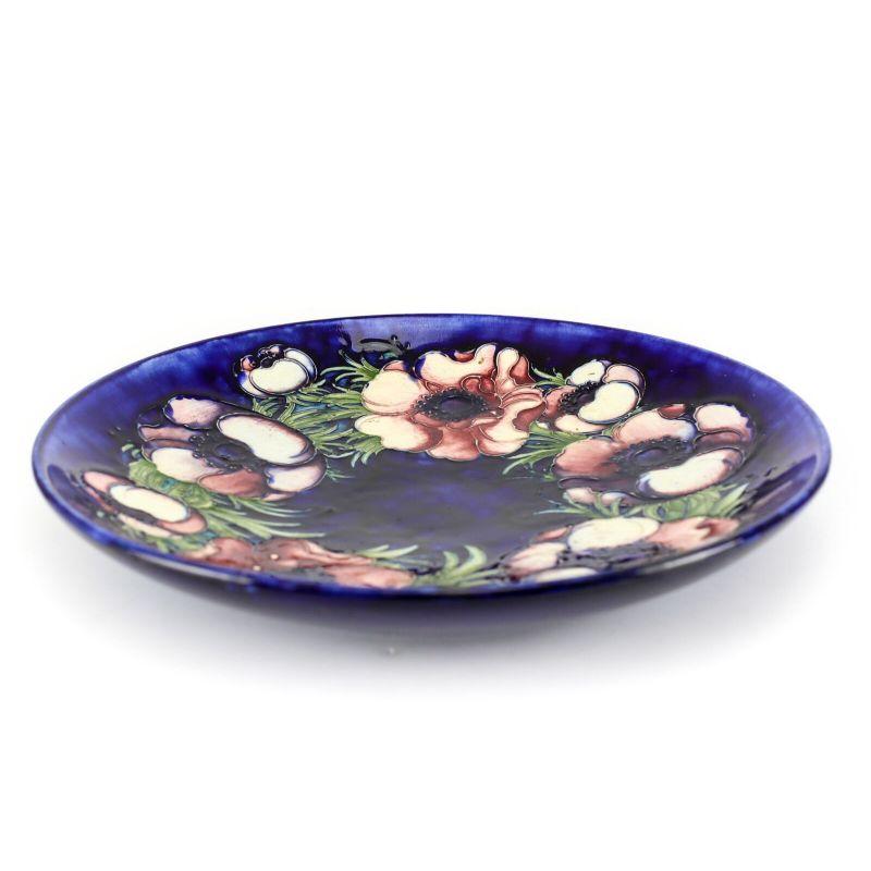 Signed Moorcroft Shallow Bowl or deep plate, in deep blue and purples Handpainted floral with raised details. Impressed mark, and Signed by artist

Additional information:
Features: Hand Painted 
Pattern: Floral
Production Technique: Pottery