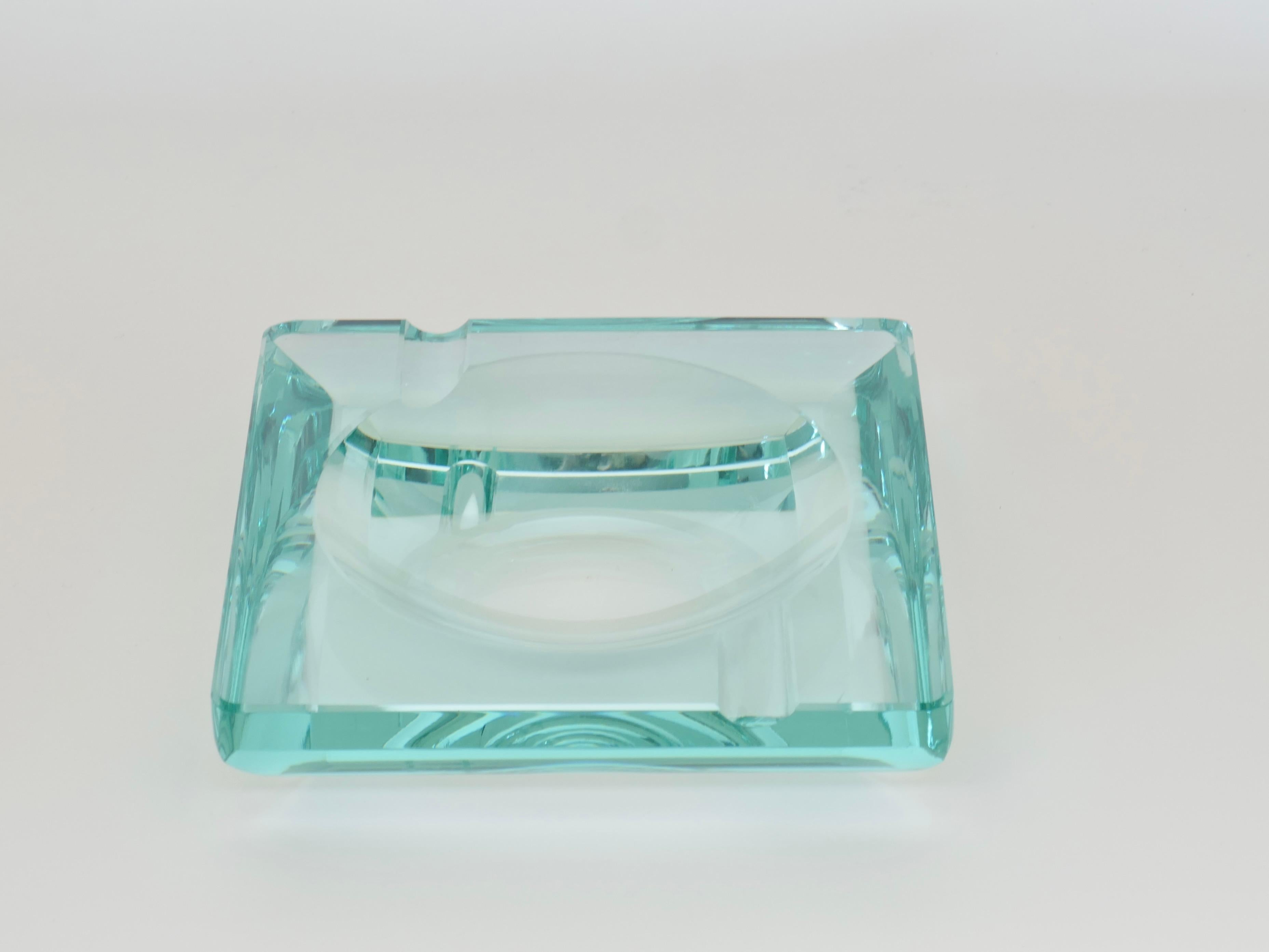 Mid-Century Modern squared blue art glass ashtray or vide poche in style of Fontana Arte.
The designer signature is not identifiable but it's dated and signed in Murano 1980.
Measures: 15 x 15 x 3 cm.
Italy 1980.
 