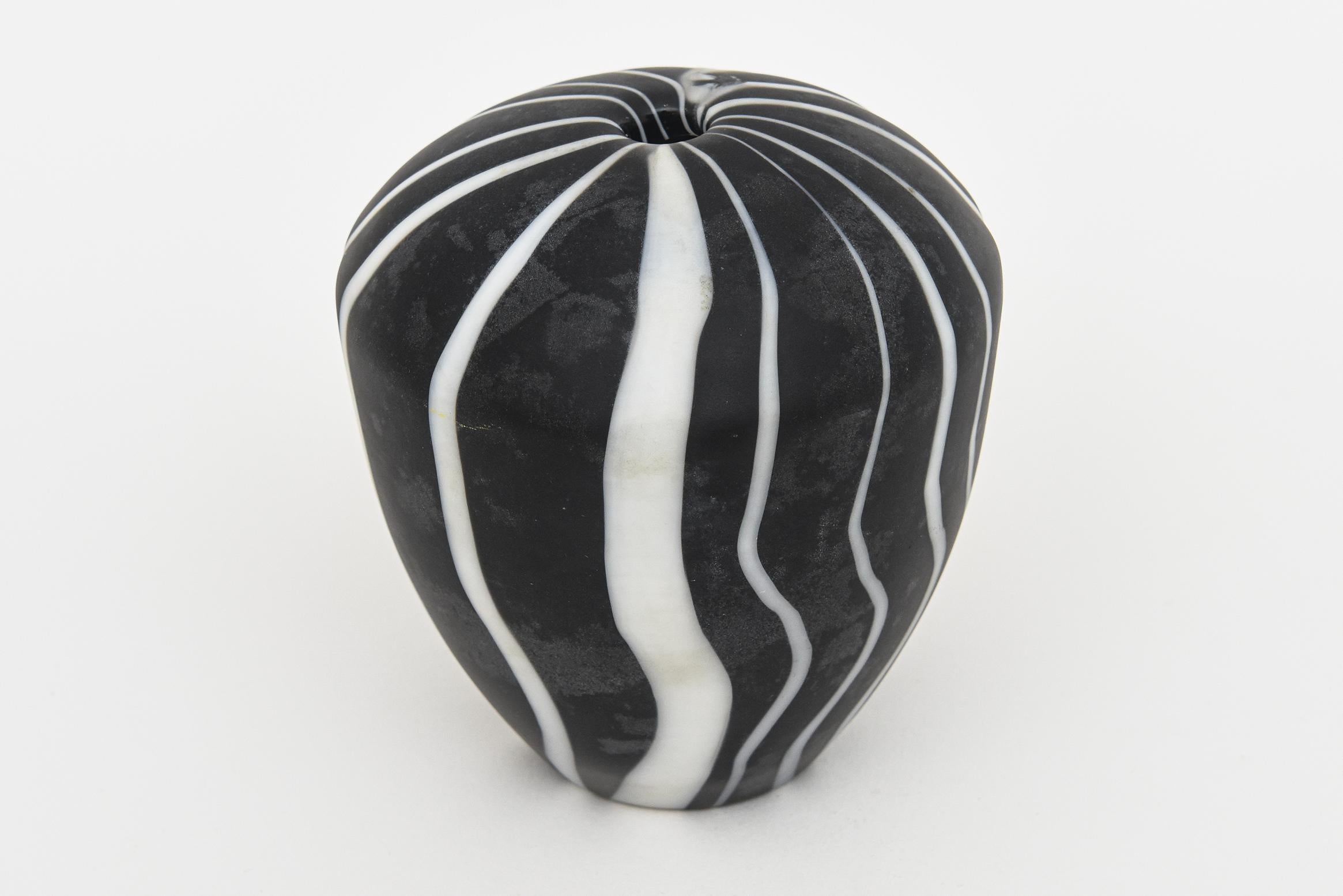 This vintage 1980's Murano signed Salviati hand blown matt glass object and or sculpture are black and white abstract stripes of wave with different widths. It is a sculpture and could also be a one bud vase. It is heavy, fabulous, unusual, optical