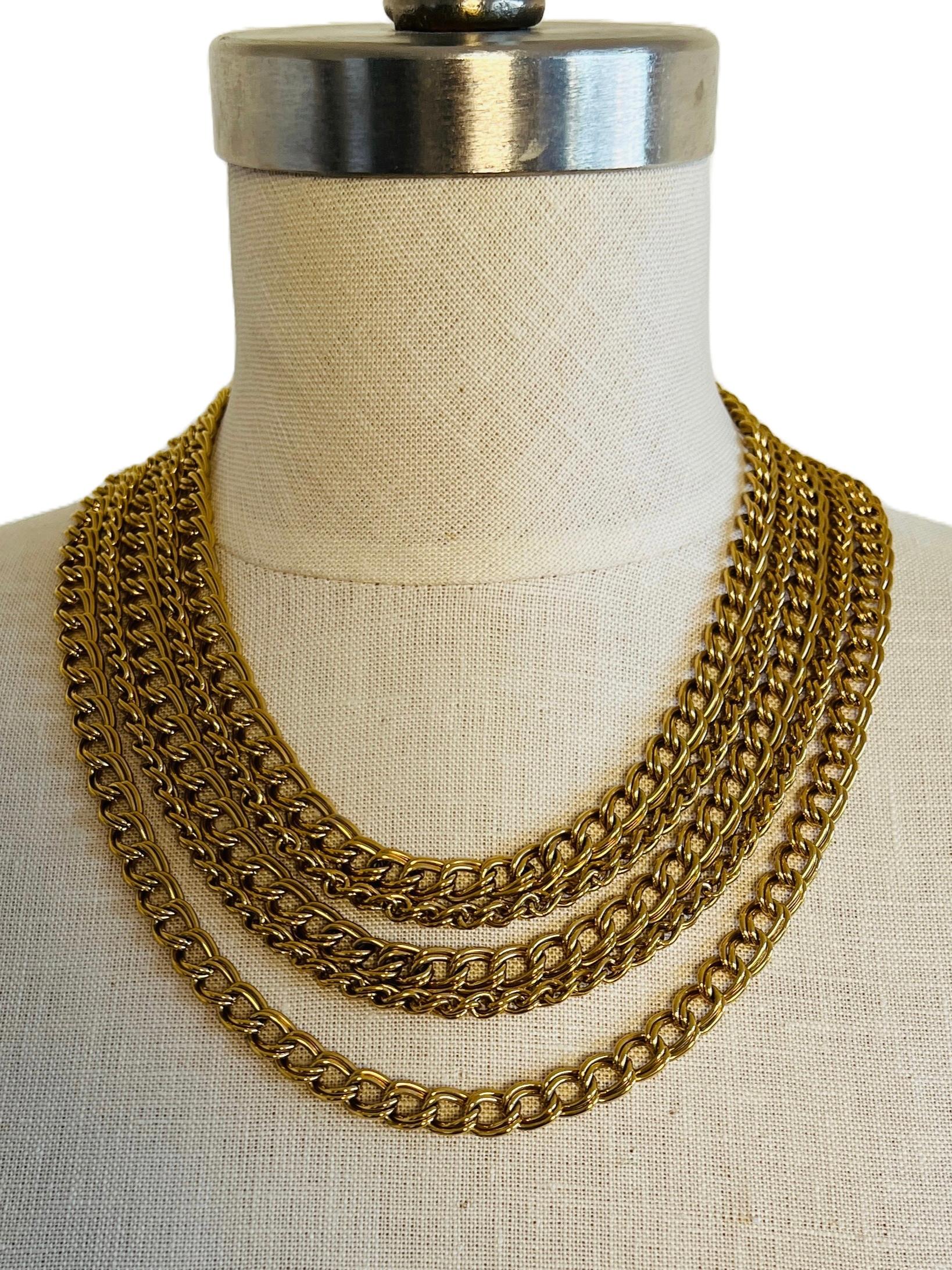 Weighing an impressive 156.2 grams, this vintage Napier necklace offers a substantial feel, closely mimicking the weight and presence of real gold. The double curb link chains are not only visually striking but also provide a luxurious, heavy feel