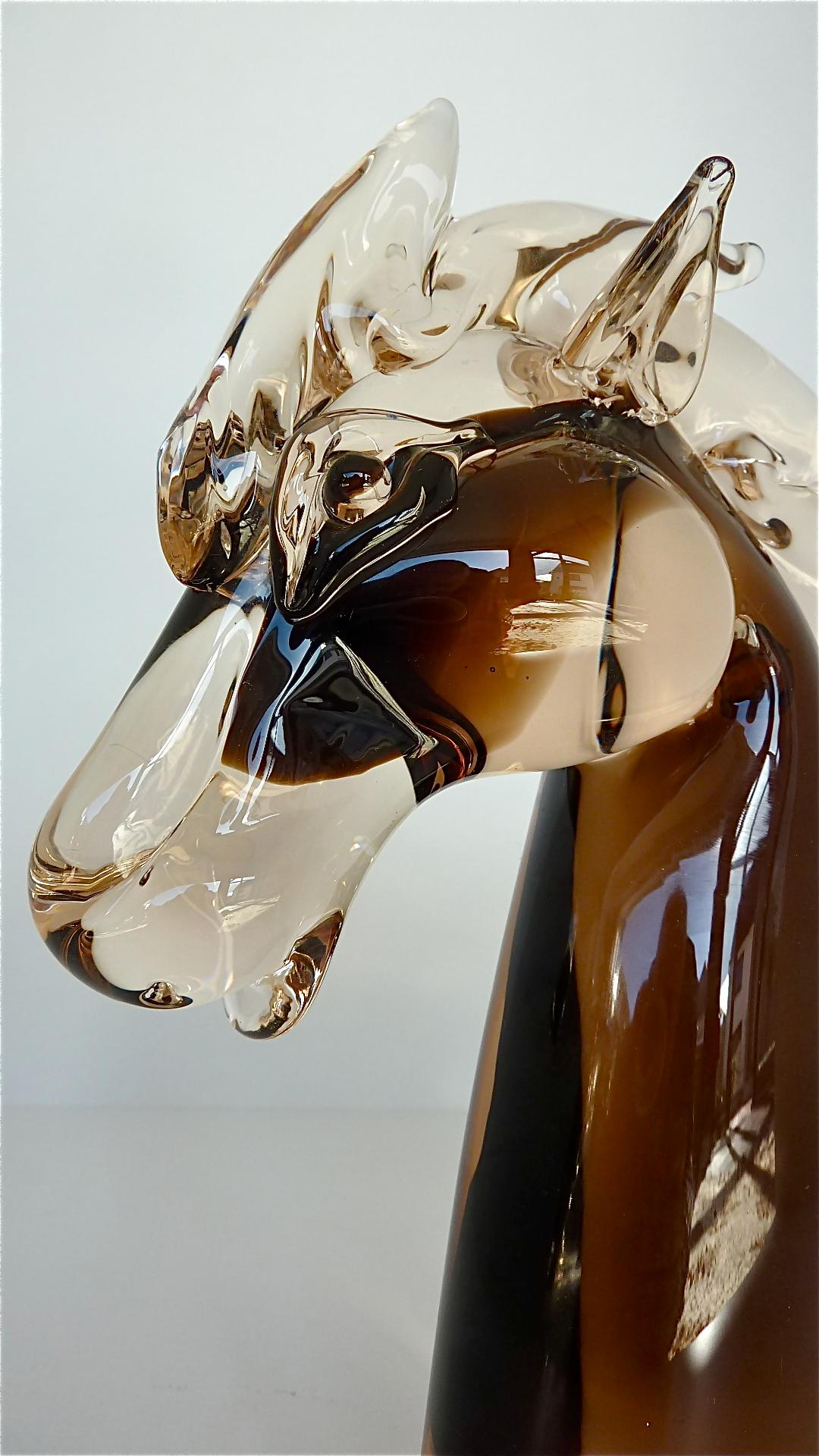 Amazing brown and clear glass horse head sculpture probably executed by the master glassblower Ermanno Nason for Nason & Moretti, Murano which can be dated around 1970. The expressive horse sculpture stays in perfect original condition with no