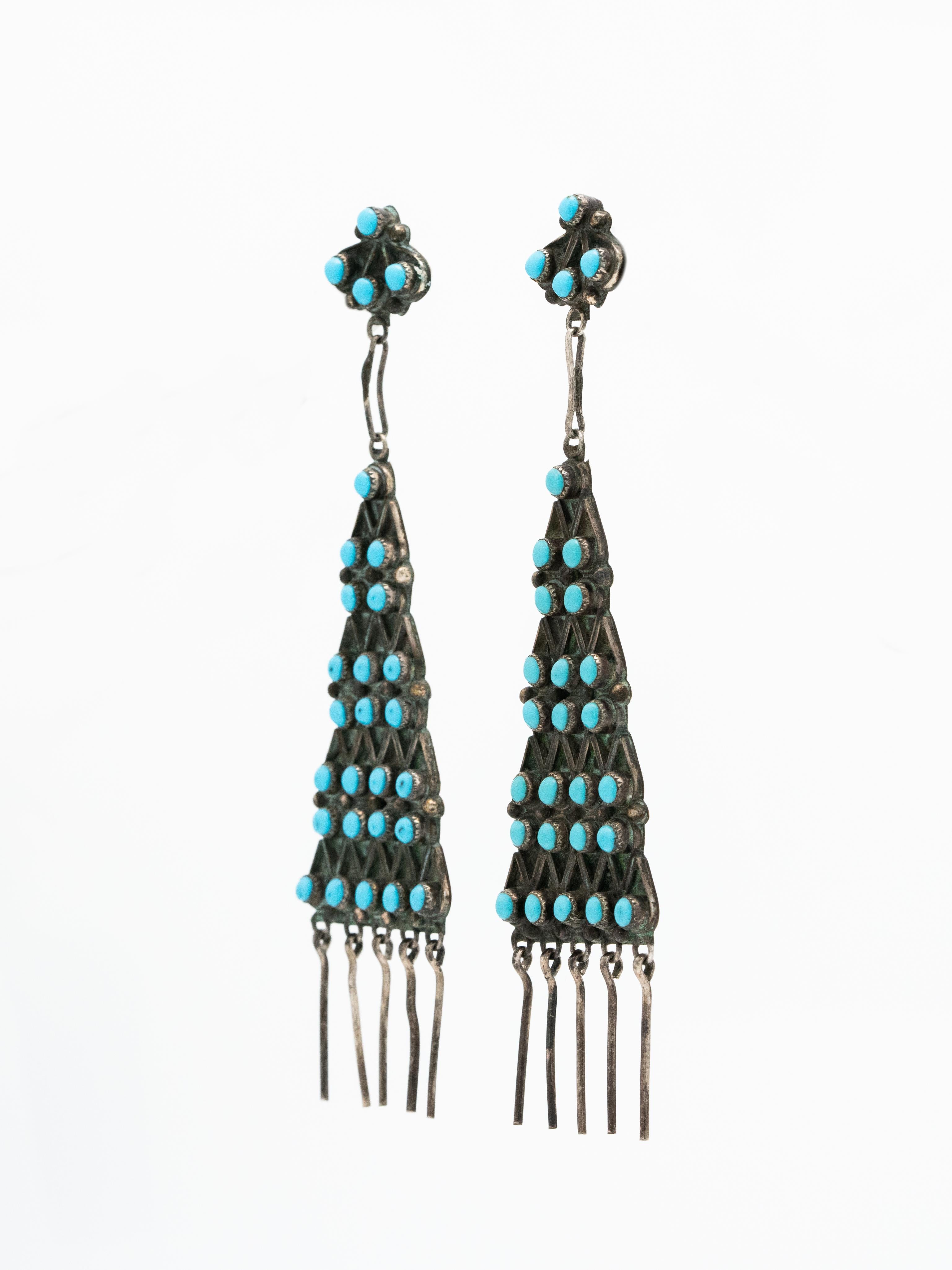 Native American Navajo Long Silver and Turquoise Pyramid Drop Earrings c.1970s

Dramatic and Fabulous. 

Length: 100mm
Width at widest point: 9.36mm
Weight: 9.4 grams per earring
Silver ear post
Signed