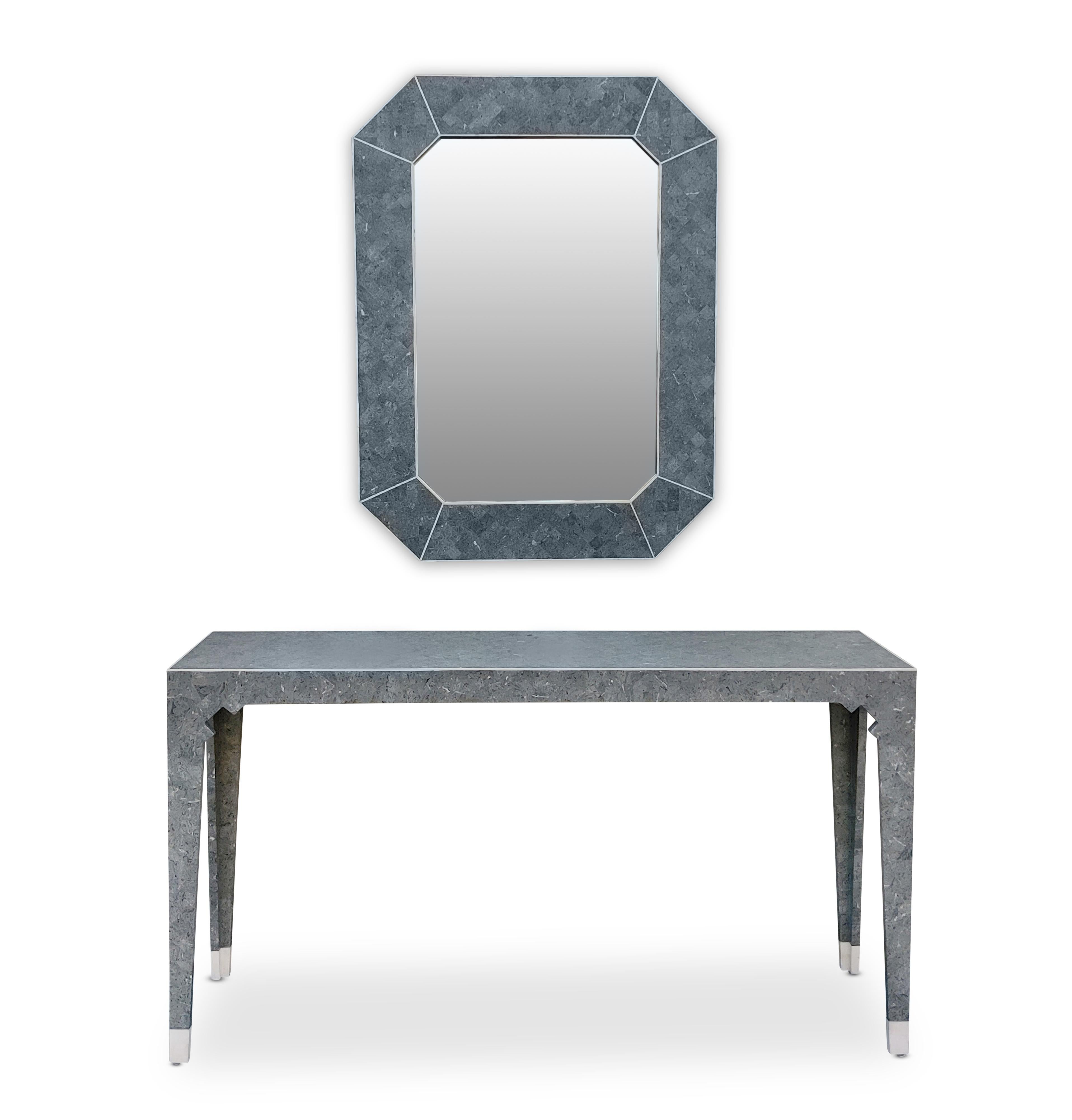 A very elegant post-modern Oggetti wall mirror and narrow console table. Similar to Maitland Smith tessellated mirror+console sets, this set was made in the late 80s or early 90s. Notice the trim styling that includes an angled mirror frame and