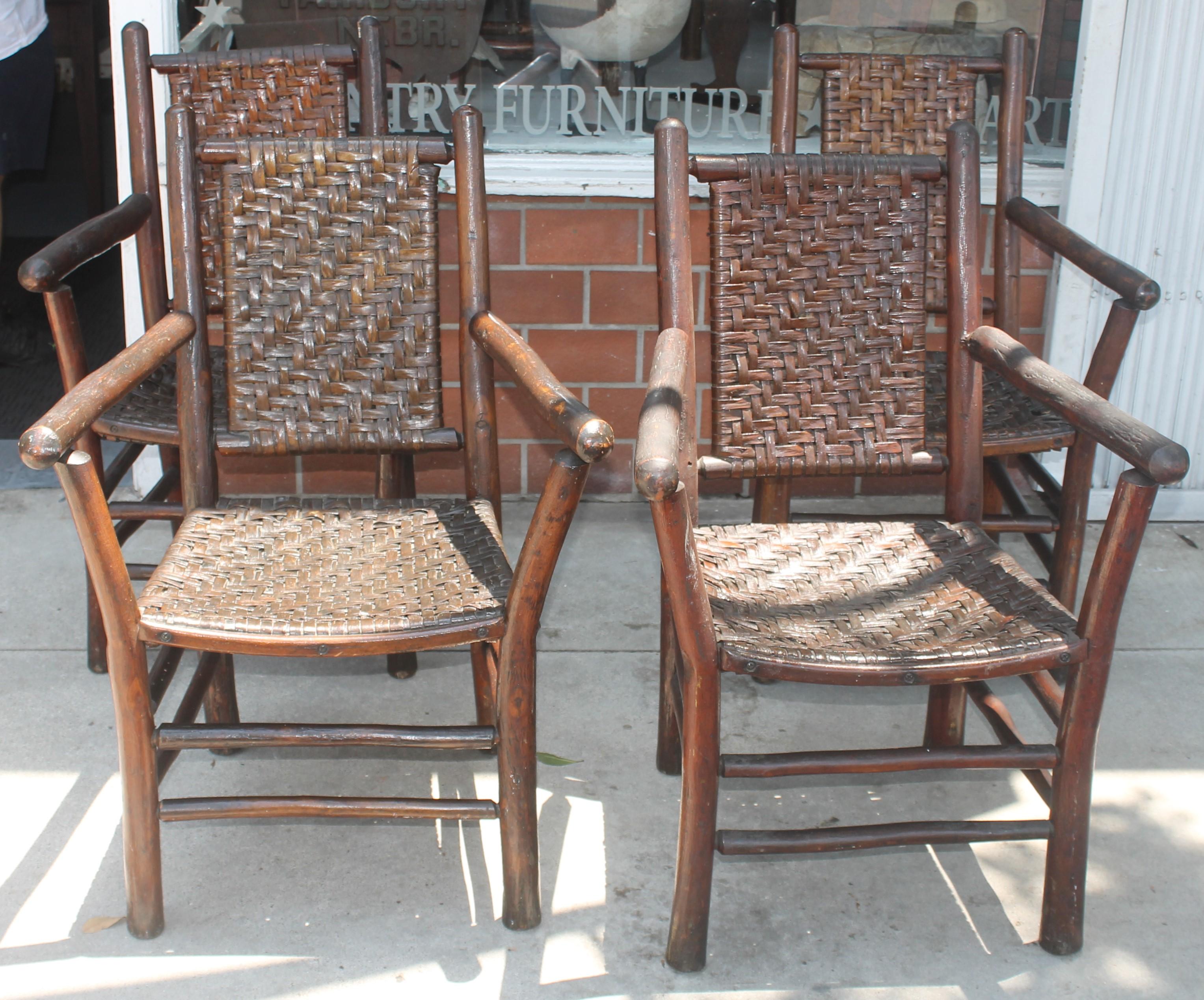 Signed old hickory arm chairs in amazing old surface in fantastic condition. These chairs have such an amazing undisturbed surface and are signed on the lower back legs: Old Hickory Furniture Company, Martinsville, Indiana. Some have the little