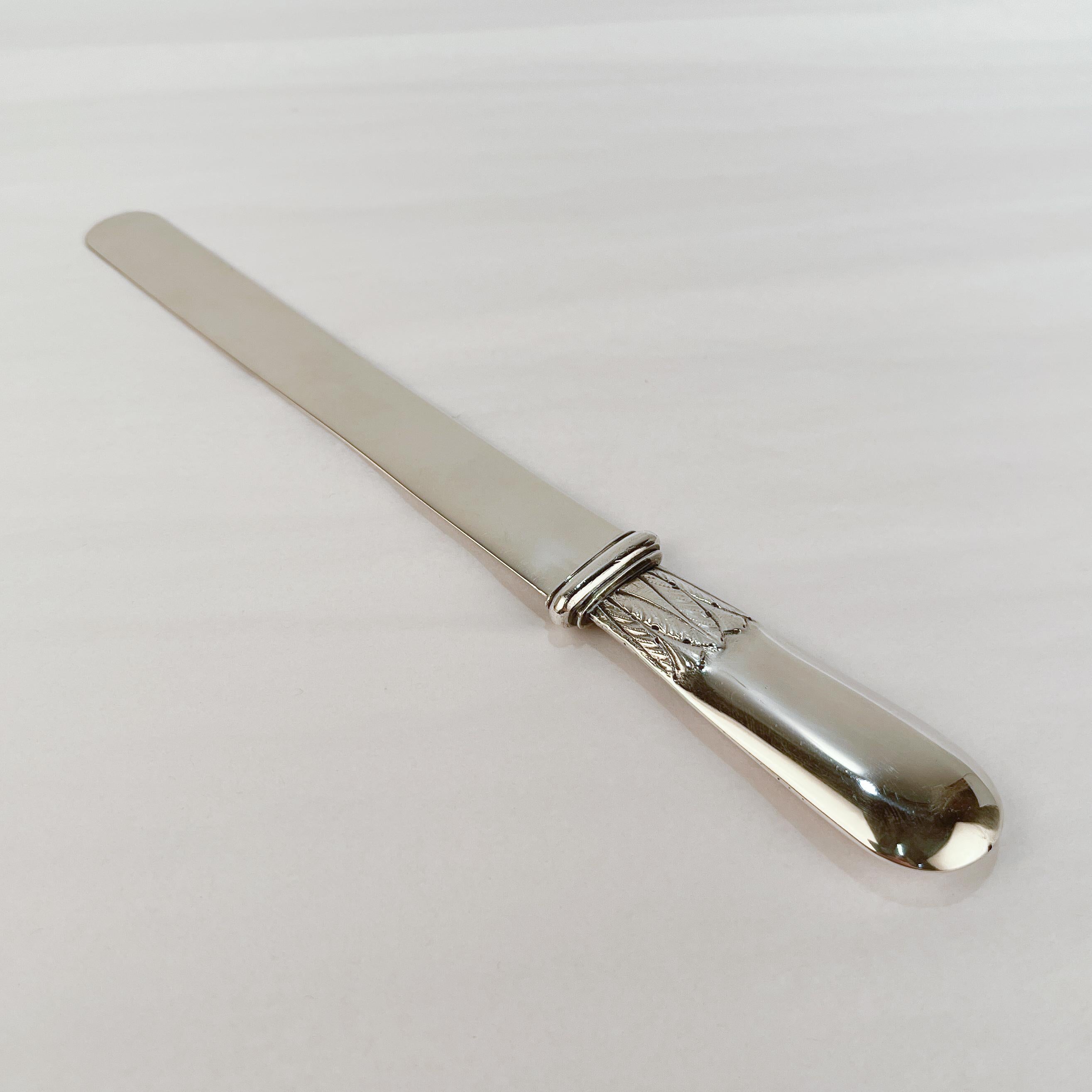 A fine Russian silver page cutter (or letter opener).

Possibly by Gerasim Mitrofanov.

With a lozenge form handle with cast leaf-work. 

Marked with a second Kokoshnik mark (1908 to 1926) for Moscow.

Simply a wonderful piece of antique Russian