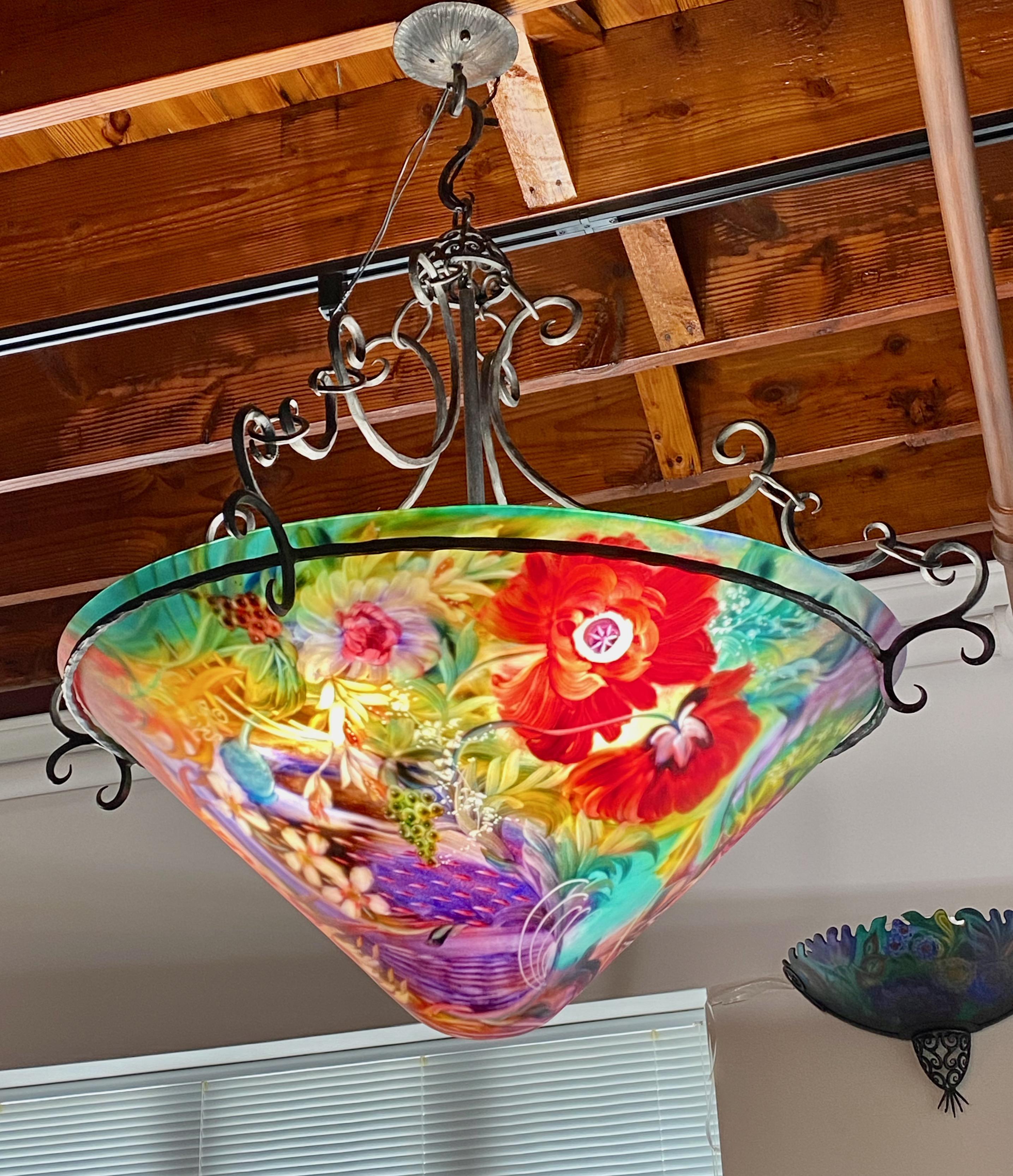 Signed original Ulla Darni cone shape with a 32 inches glass diameter. The overall diameter of the chandelier is 39 inches. The chandelier is reverse painted on glass with hand-forged iron work. Ulla starts with a blank glass surface to paint on.