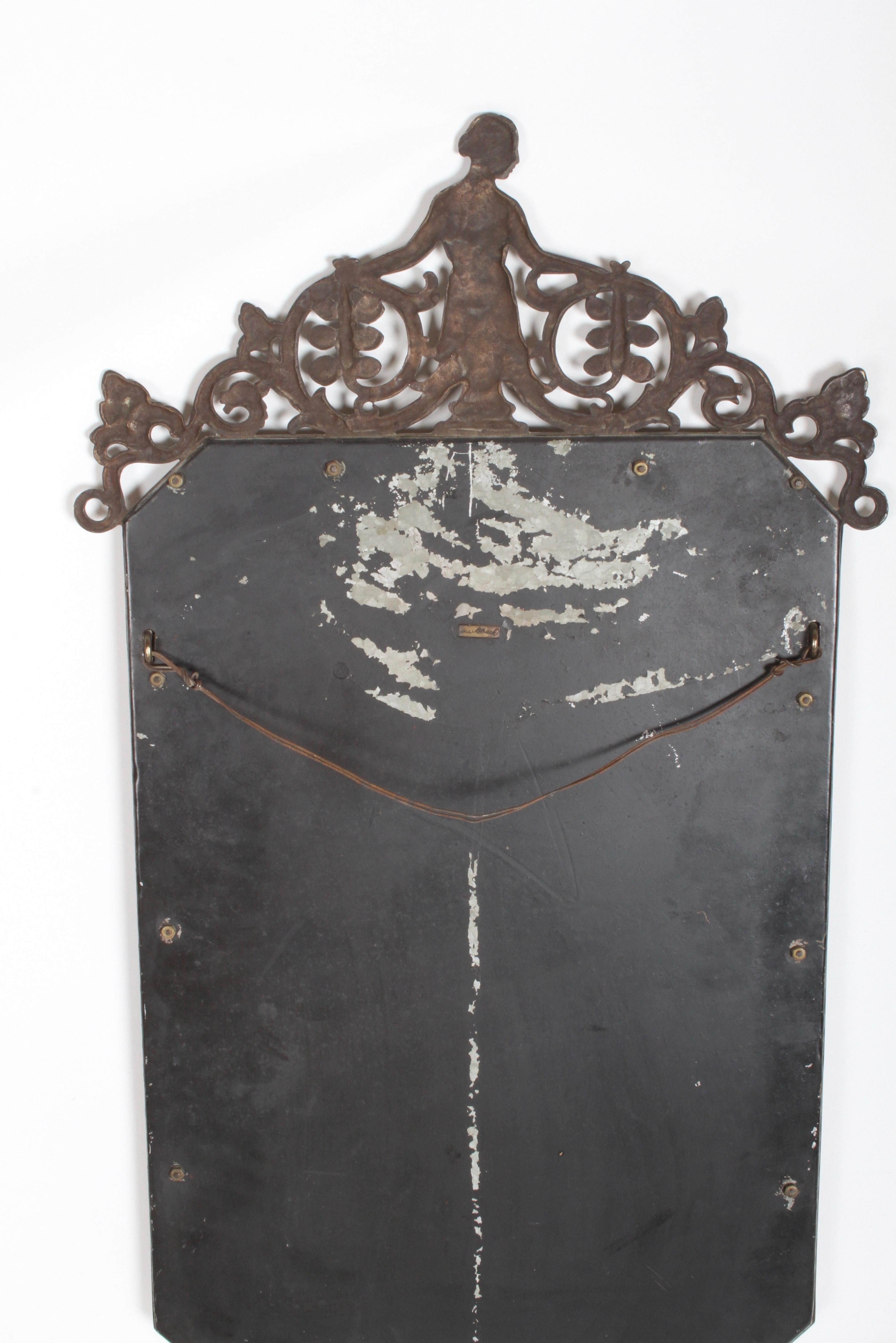 Stunning bronze Oscar Bach wall mirror with female nude, ornate scroll details, plus a steer skull, signed on back, circa 1920s, art Nouveau or Arts & Crafts style. Mirror is 15.25