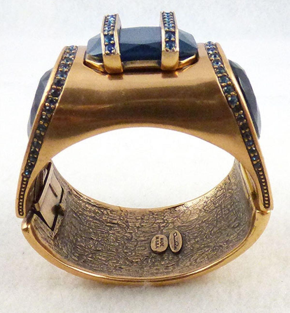 Designer Signed Oscar de La Renta Modern Sculptural hinged Cuff Bracelet.  Outstanding unique design. The top is set with a navy blue octagonal resin stone, the flat sides set with huge navy resin teardrop stones. Two bars set with navy crystals