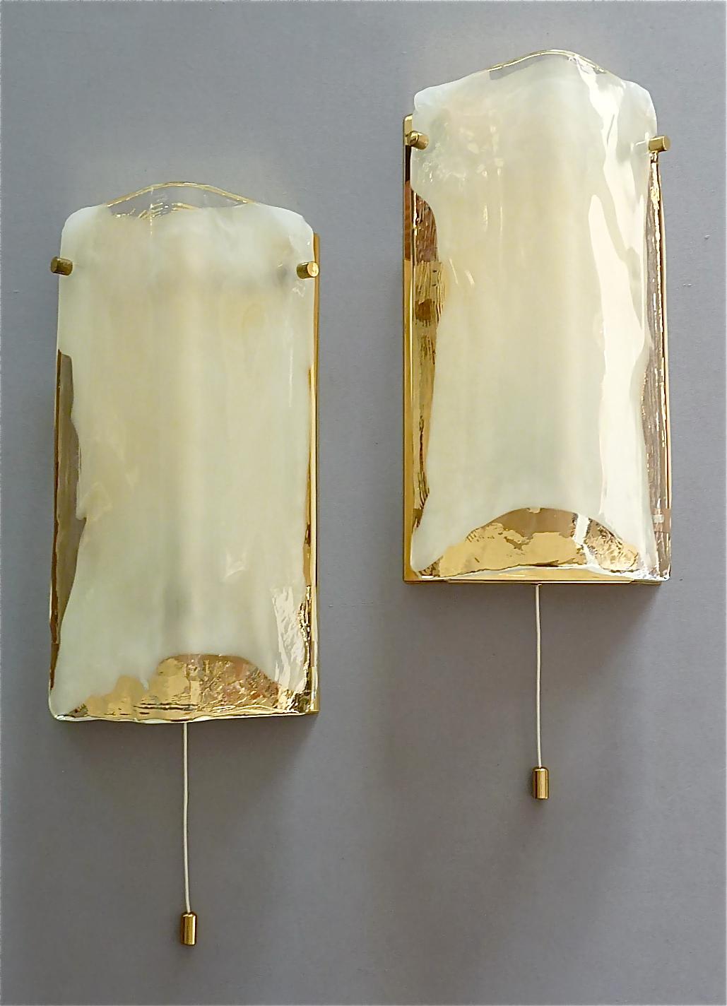 A beautiful pair of wall lights or sconces by J.T. Kalmar, Austria, circa 1960-1970, made of brass and crystal glass. The modern and stylish model is typical for Kalmar, highest quality comparable with Venini, Mazzega and Kaiser, and best materials.