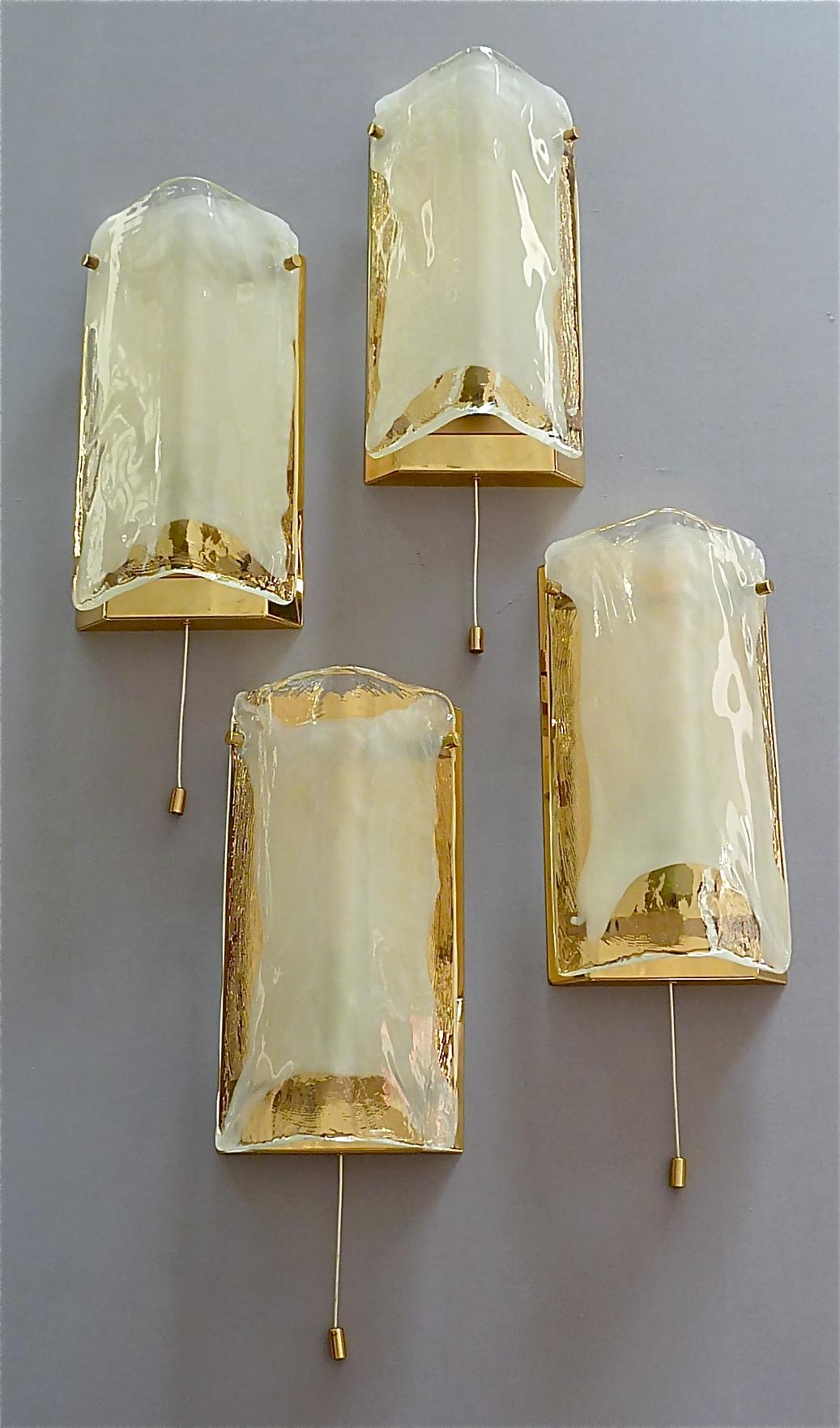 A beautiful pair of wall lights or sconces by J.T. Kalmar, Austria, circa 1960-1970, made of brass and crystal glass. The modern and stylish model is typical for Kalmar, highest quality and best materials. The sconces have a partly patinated brass