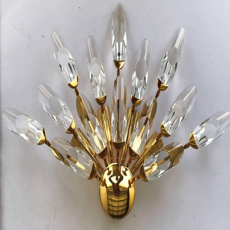 Superb signed pair of sconces by Stilkronen, made in Italy 14 crystal four lights, 40 watts max bulb US rewired and in working condition Custom backplate available.
 