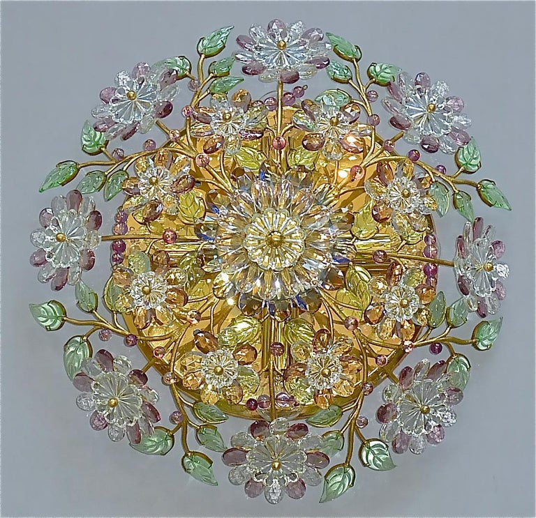 Round brass and gilt metal crystal glass floral flush mount chandelier made by high class lighting company Palwa, Germany, circa 1950s to 1960s, documented in the Palwa sales catalog and signed with Palwa company label on reverse. Often wrongly