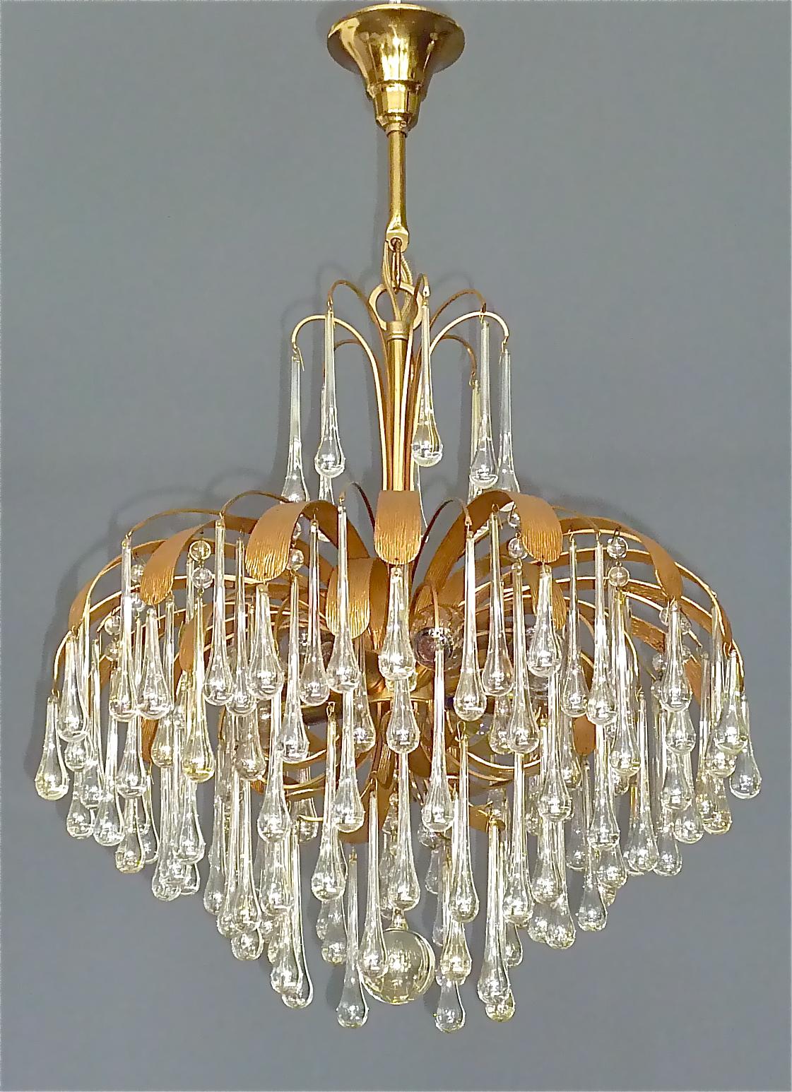 Large signed gilt brass flower sputnik chandelier with elongated slightly tinted shimmering Murano glass drops and pearls made by Palwa, very in the style of Venini, Germany circa 1960-1970s. The gorgeous pendant lamp has a gilt brass metal sputnik