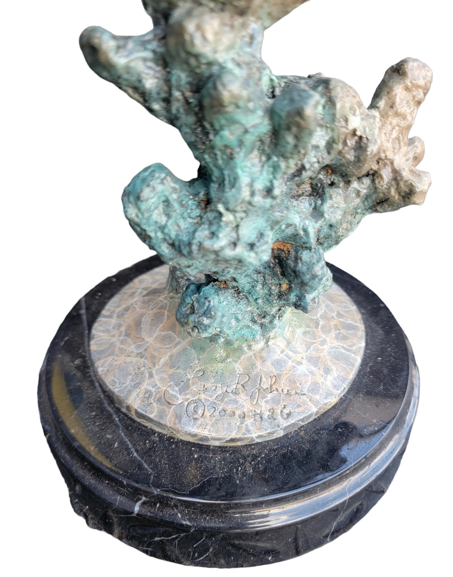 Signed Patinaed Whale With Marble Base. Beautiful blue patina. Aged color pallet with wear only time can do. Bronze and marble come together to make this Sculpture feel as if the viewer is watching the whale dive deeper into the abyss. Great look.