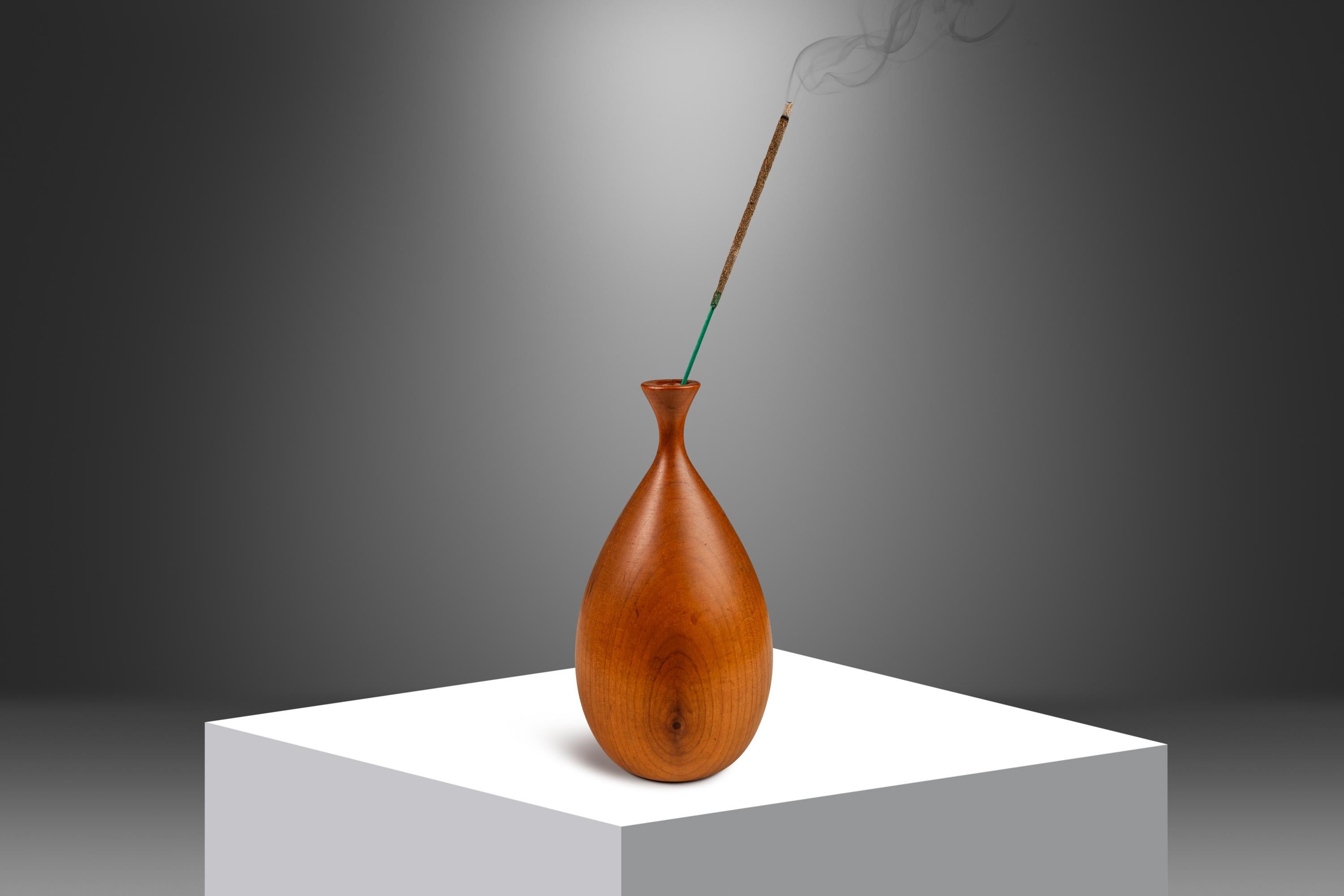 Introducing an expertly crafted and elegantly shaped minimalist vase hand-tooled by the well respected German-American wood worker George Biersdorf. Petite in size yet grand in shape this exquisite wood-turned vase, carved from solid walnut, is the