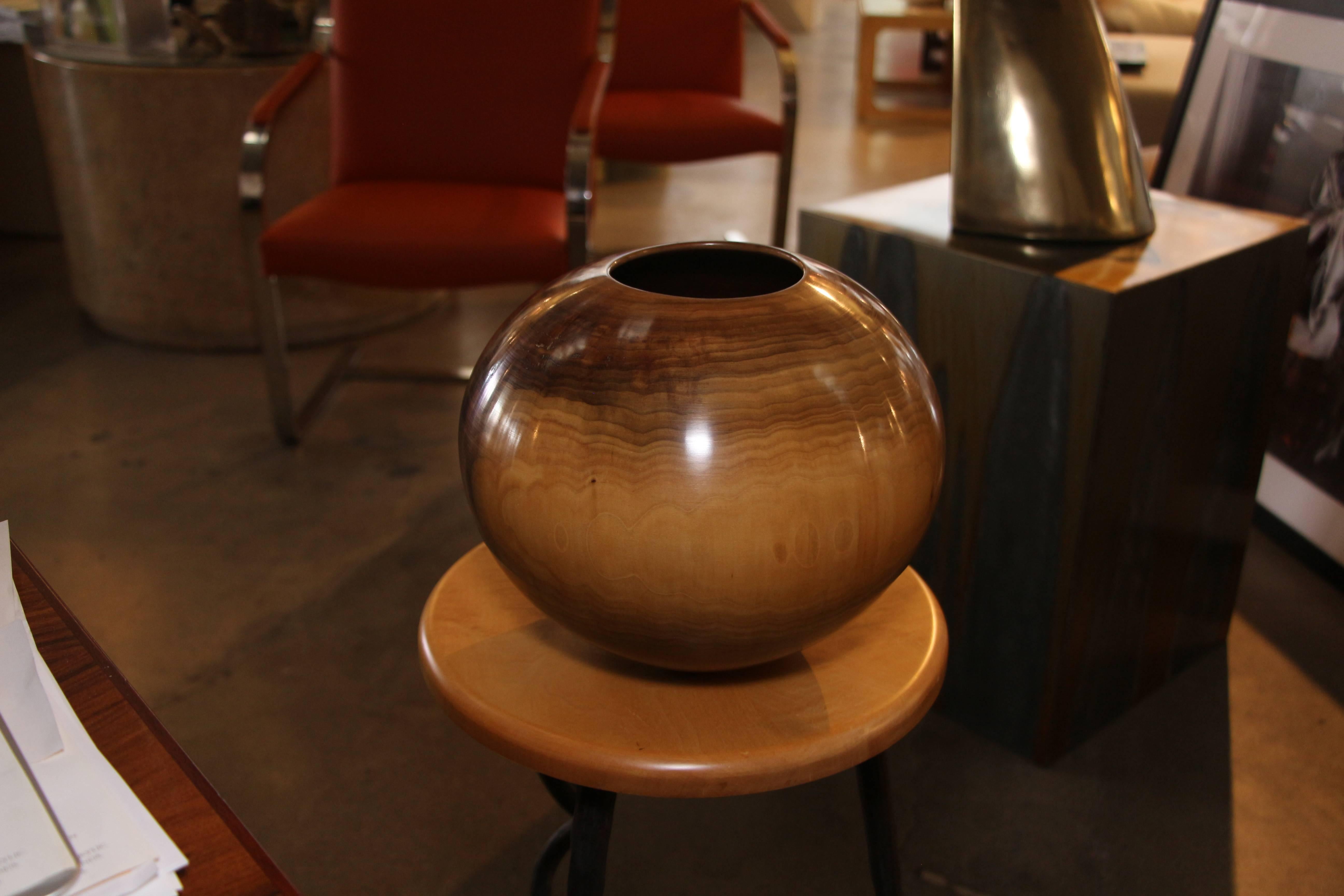 A beautiful tulipwood turned vessel by Philip Moulthrop. It is signed on the base and the wood identified. There are some minor flaws in the finish and wood surface, including one bubble near the base to the varnish or lacquer finish.