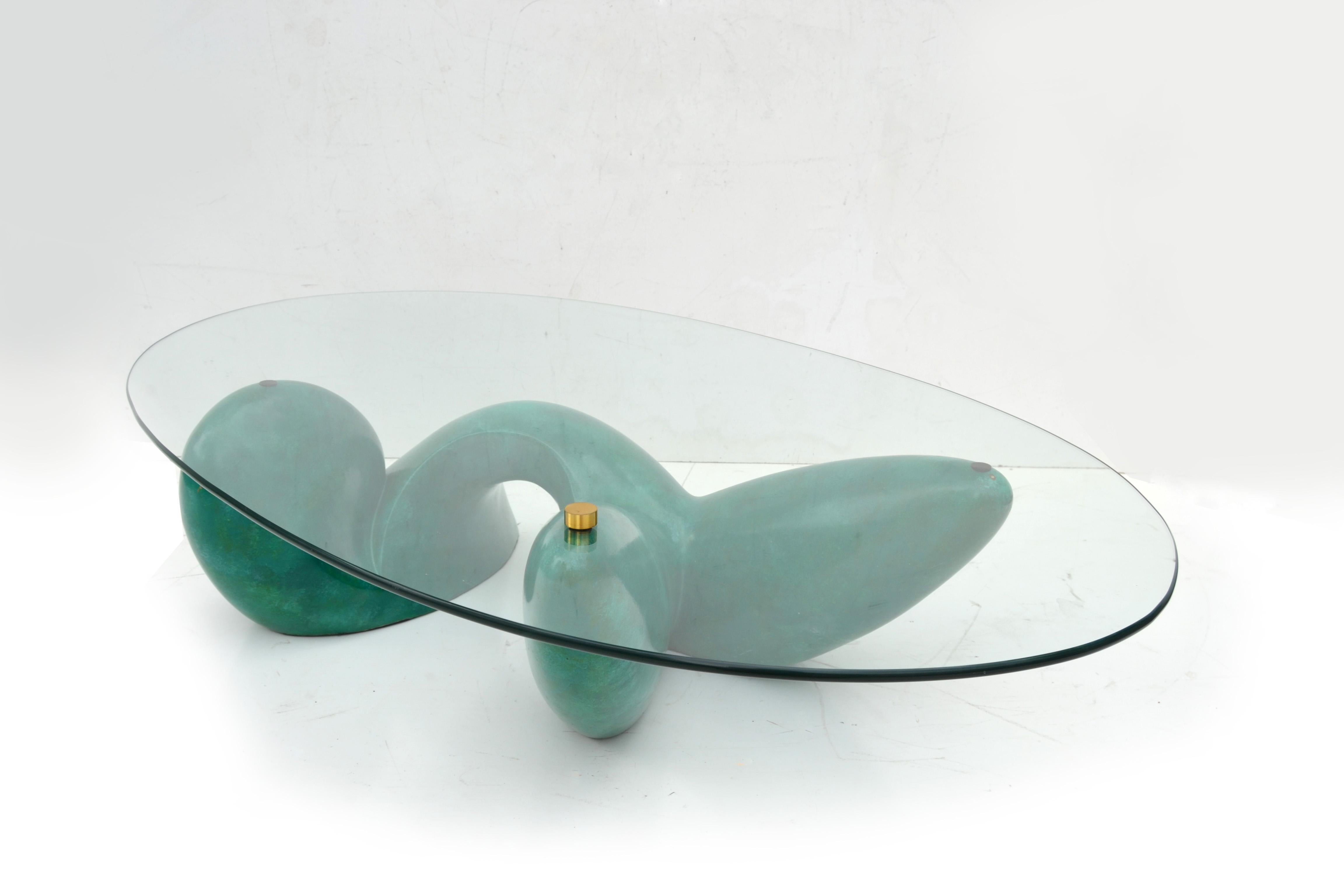 One of a Kind Signed by Artist Philippe Jean Leda coffee table made for Maison Jansen 1975 in France.
Abstract base topped with an oval shaped Glass which is securely screwed into the base.
This coffee table is from an edition of approximately 20.