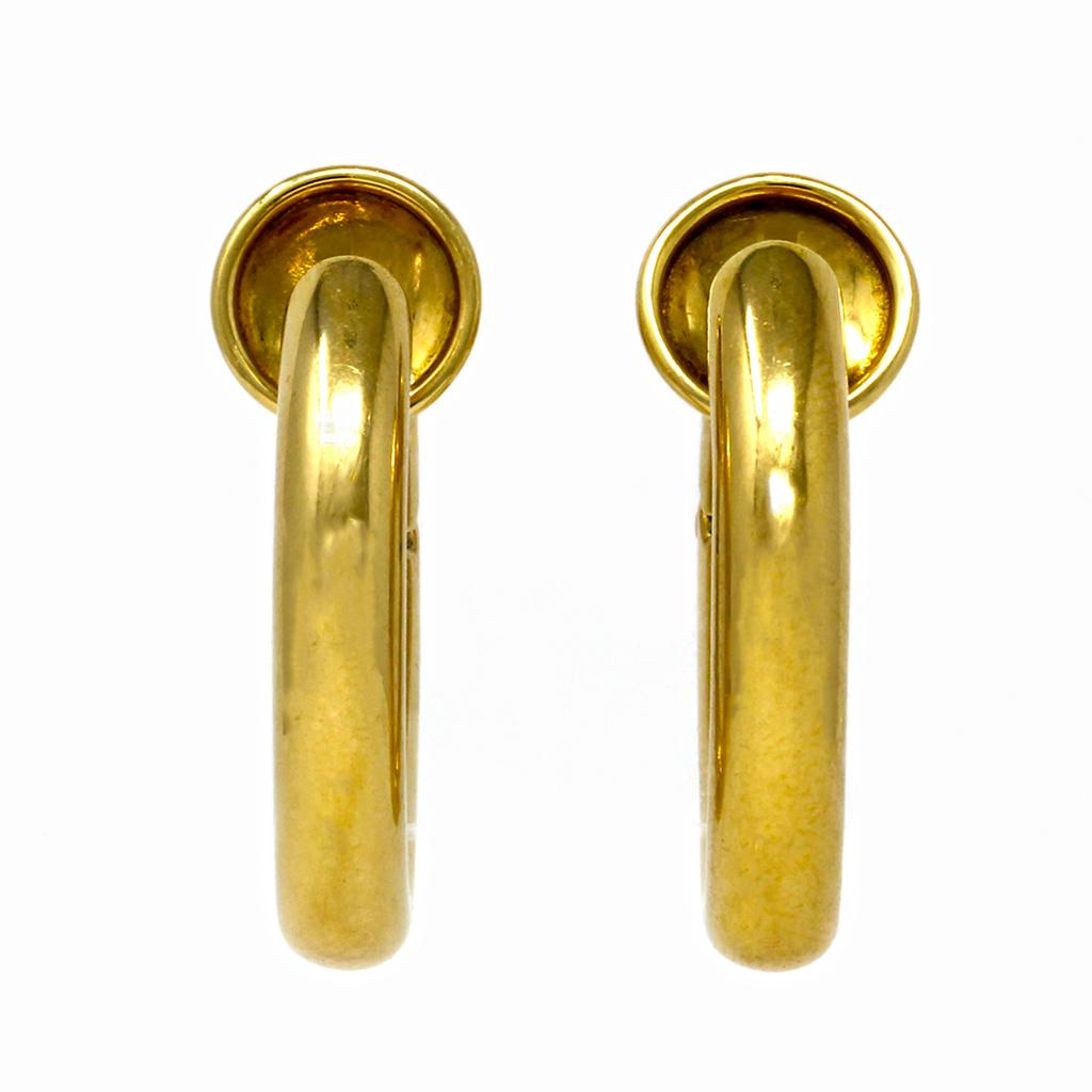 A Pair of 18 karat yellow gold clip-on earrings by the famous Italian house of Pomellato. This cleverly designed hoops are meant for people who do not have pierced ears. These modern minimalistic hoop earrings are high polished in 18 karat yellow