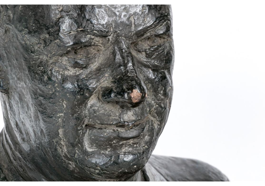 Clay bust of President Eisenhower in a bronzed finish and surmounted on a hand-crafted wooden plinth base.
Signed indistinctly lower back, “Andrew’s”. 

Dimensions: 7 1/2