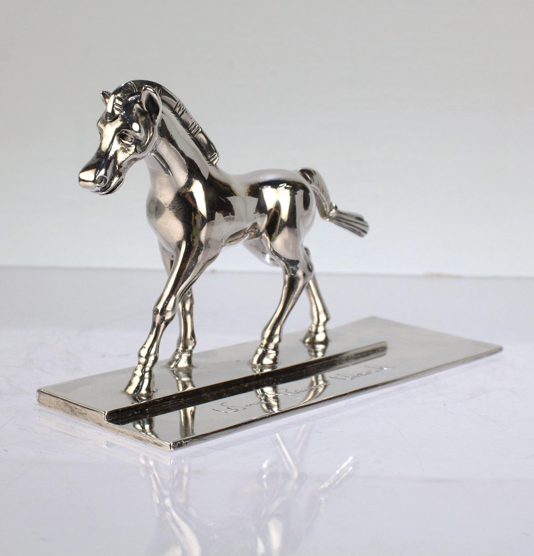 A very fine and rare Erik Magnussen sterling silver paperweight. 

Depicting a horse in stride mounted on a stepped silver base.

The base bears an engraved name or dedication.

Simply a wonderful object from one of the 20th Century's finest