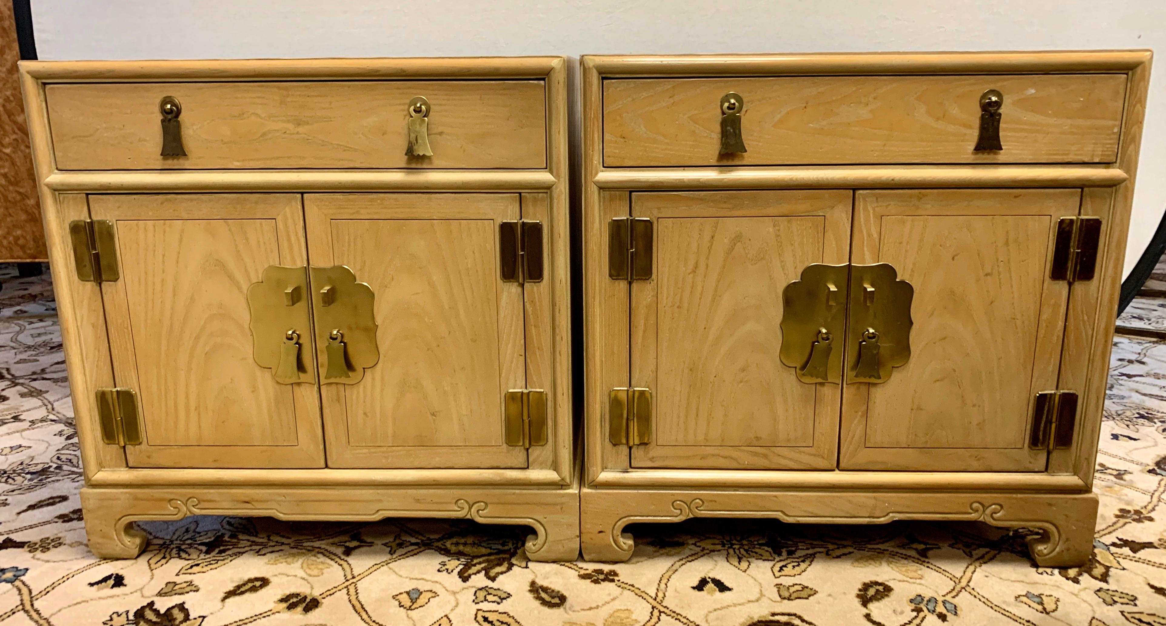 A gorgeous matching pair of nightstands by Ray Sabota for Century Furniture Company, circa 1970s. Brass hardware and lovely motifs accent the pieces. Excellent vintage condition. Retains the maker mark and Sabota label as well.