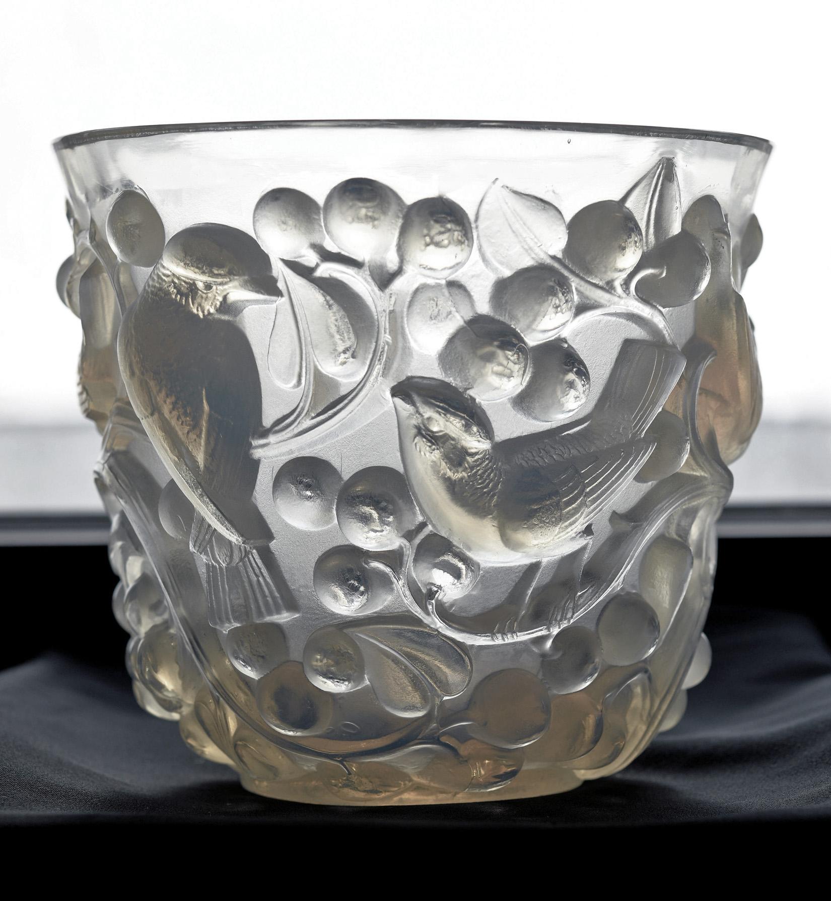 René Lalique Avallon vase, circa 1930. The vase with relief birds in foliage motif opalescent glass, signed R. Lalique. Size: Height 5.75 inches, 14.5 cm.