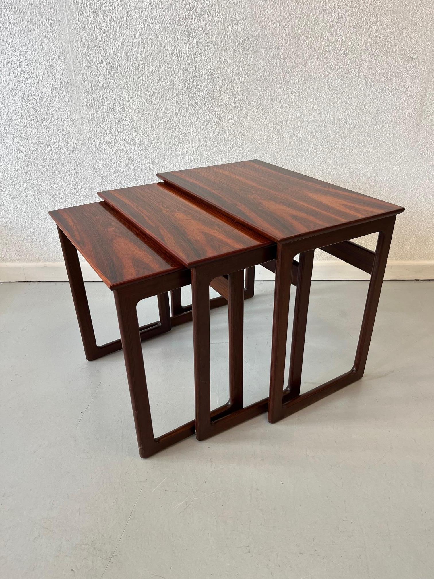 Lovely set of 3 nesting tables made of Rio Rosewood, signed with a manufacturer label we cannot identify but clearly a quality manufacure from Denmark ca. 1960s
Good vintage condition. The table tops have been refinished by a professional.


