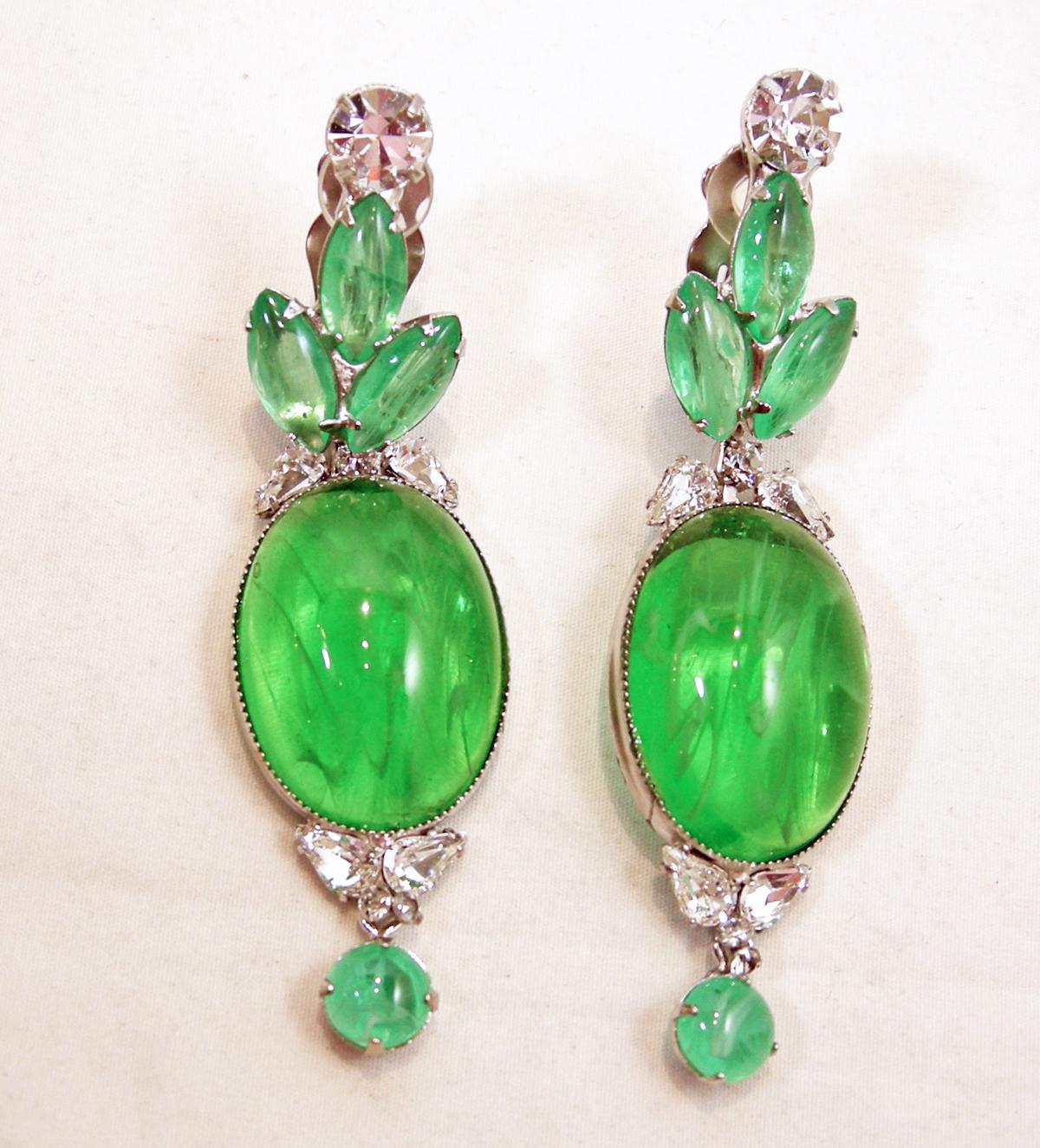 These “One Of A Kind” Robert Sorrell earrings have green and clear crystal on top with a beautiful hanging green marbled crystal in a silver tone setting.  In excellent condition, these clip earrings measure 3-1/2” x 1” and are signed “Sorrell