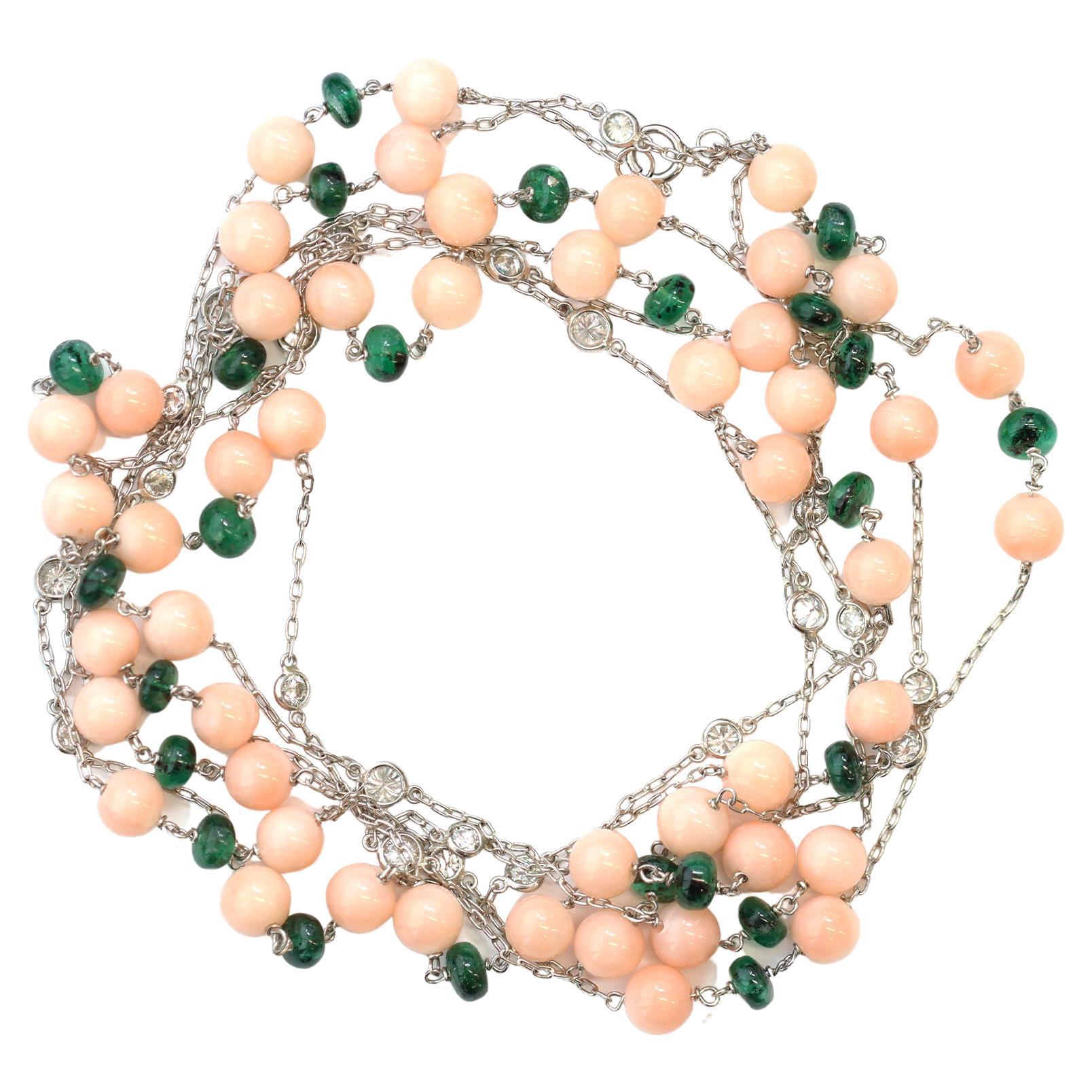 The long station necklace created by Rosaria Varra features natural untreated pink Angel-skin bead coral alternating with polished emerald bead and bezel set round diamonds. The estimated weight of the diamonds is 2.44 carats, GH color, and VS-SI