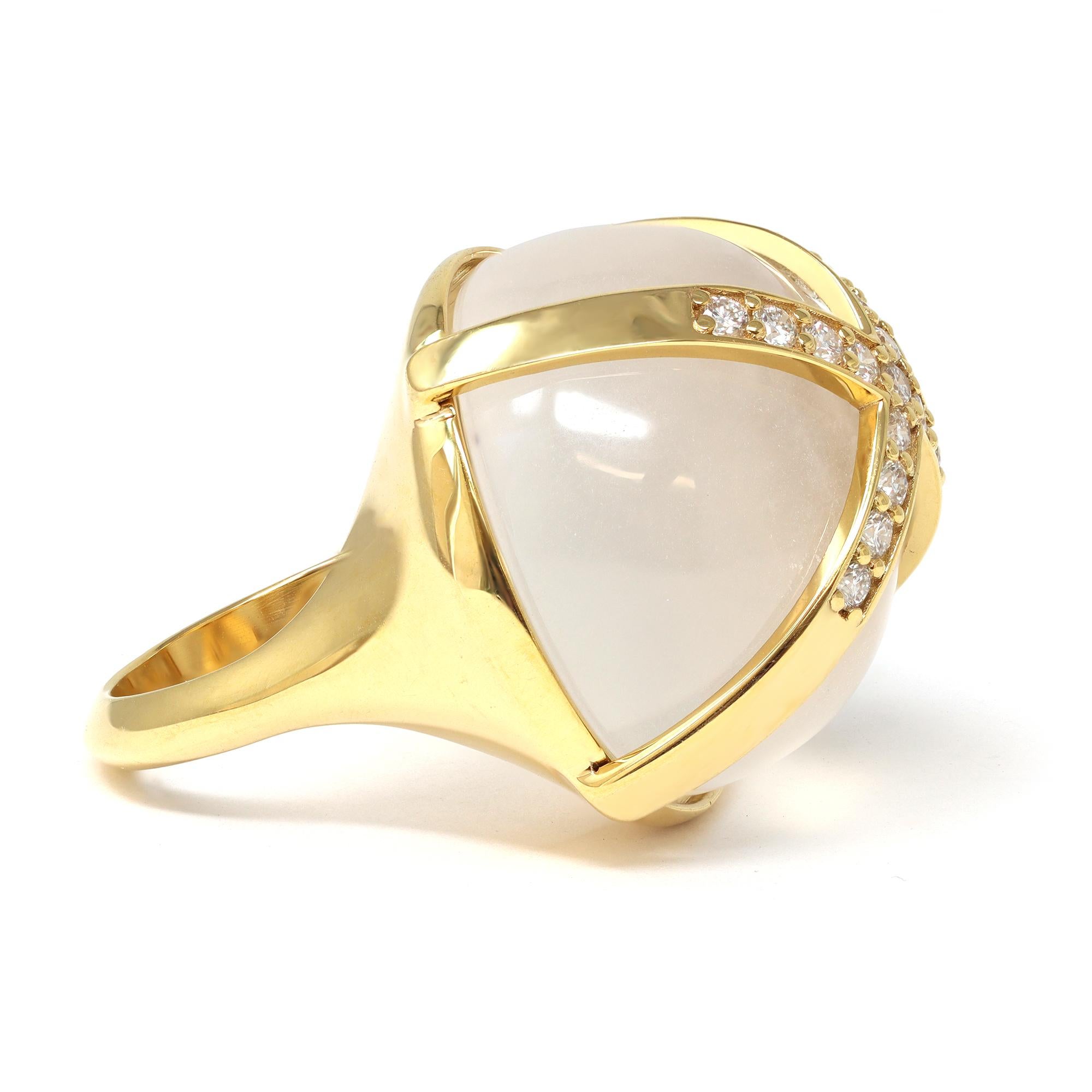 A unique statement-like cocktail ring created by Rosaria Varra featuring a natural translucent Jadeite jade Cabochon AKA Ice Jade. The jade is caged by a crisscross gold and diamond design. The Jadeite is natural with no indication of treatment. The