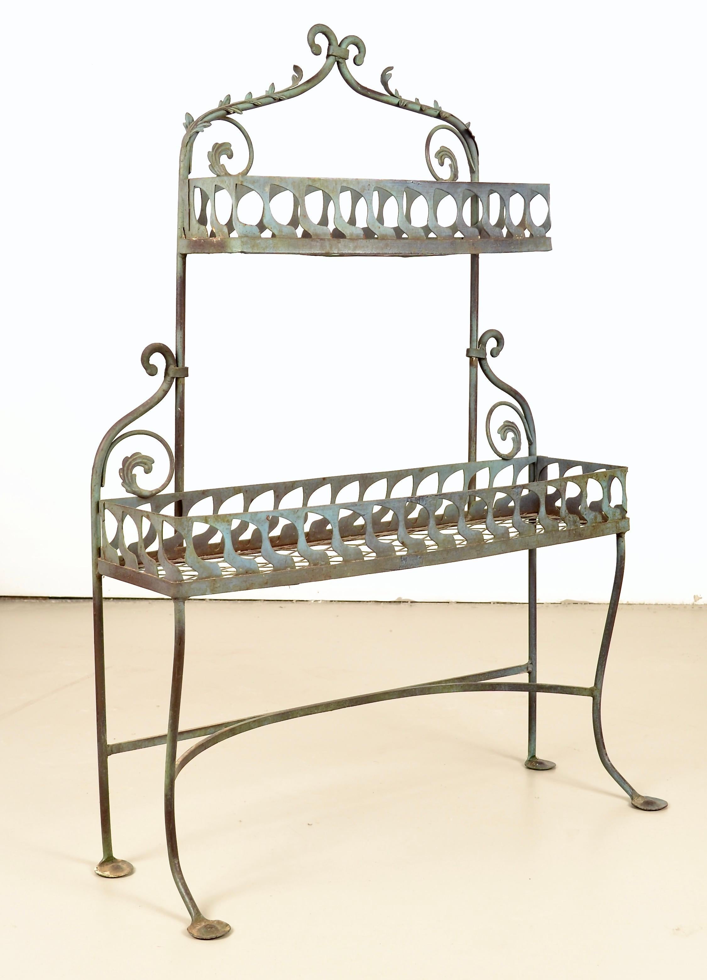 Made by Salterini and purchased by original owners in 1957, this handsome plant stand was powder coated in the classic Salterini seafoam color. The planter has great heft and very fine sturdy construction, no erosion at all in the iron. The original