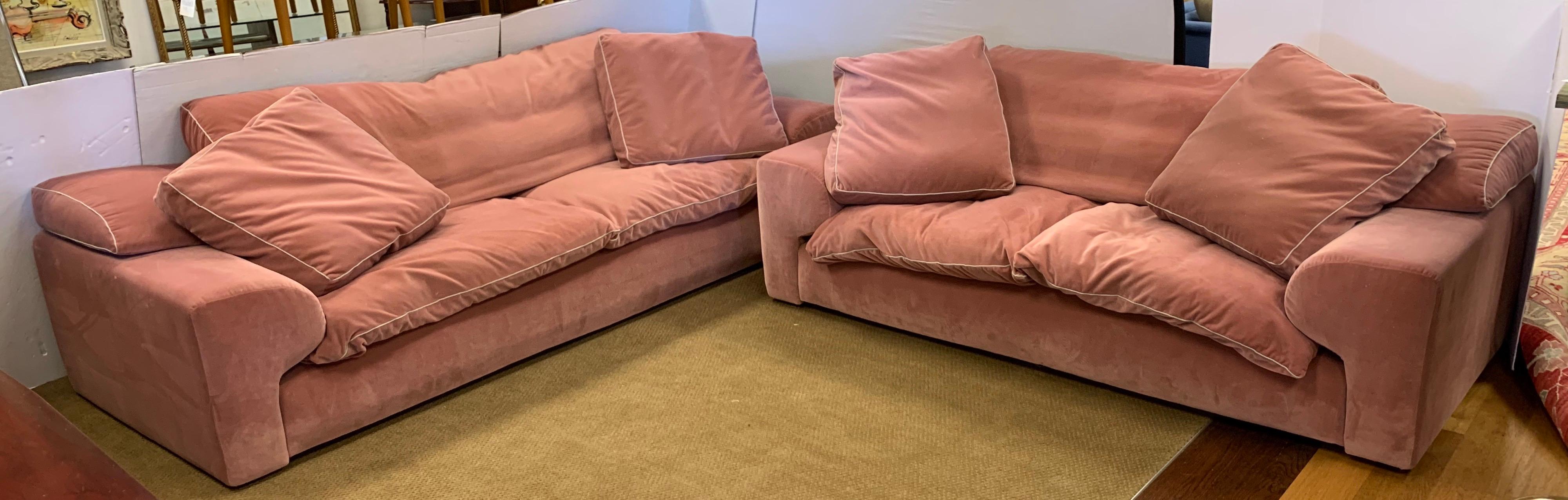 Postmodern signed set of matching Roche Bobois furniture. The sale is for a three-seat sofa and the matching loveseat. Dimensions for each piece are below, circa 1990s, this set features and extraordinary pale pink velvet fabric that is both