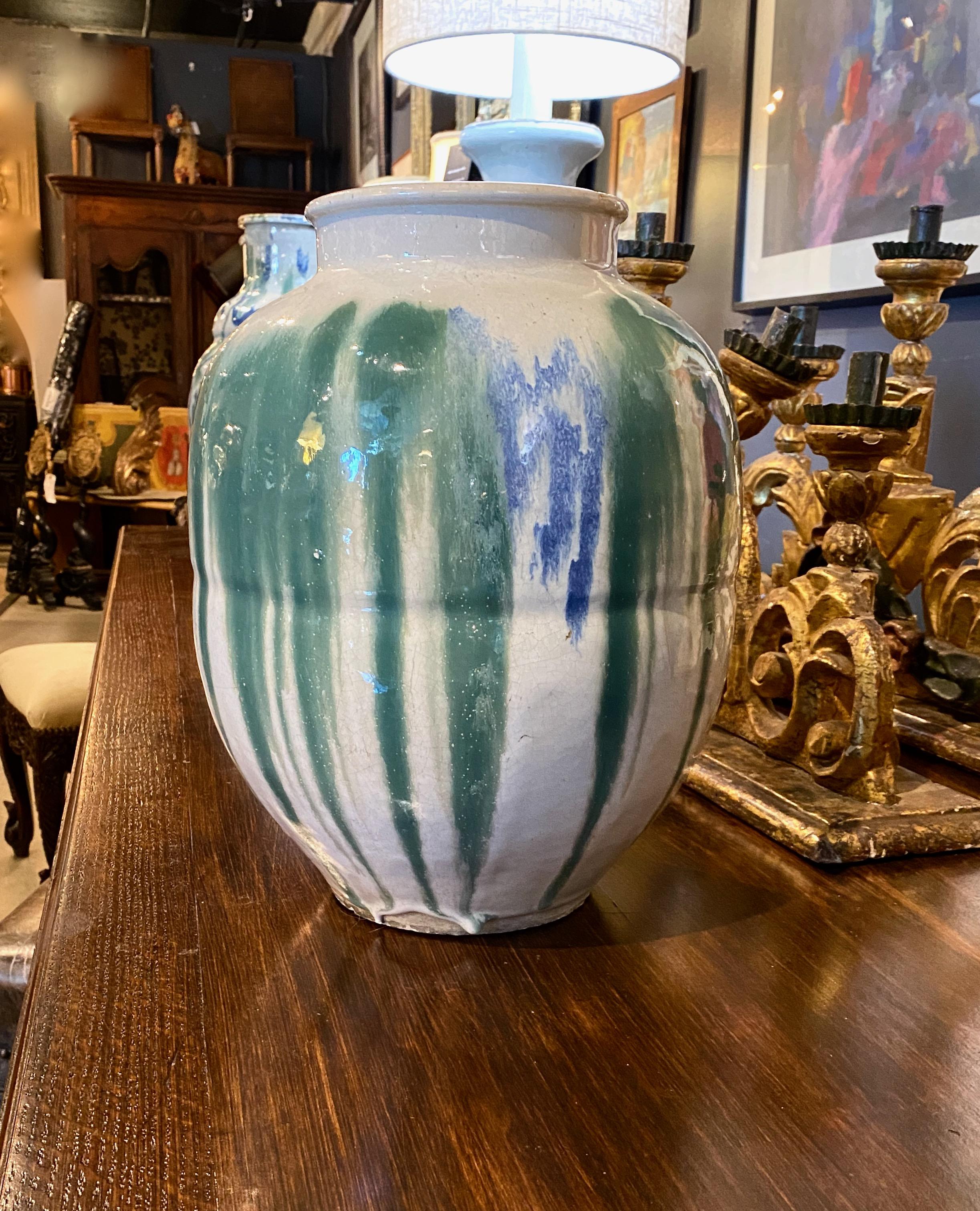 This is an exceptionally beautiful signed Shigaraki tea storage jar that dates to the later Meiji period. The quality of craftsmanship is exceptional. The thick drip glaze is abstract in style and conveys graceful light and movement. The jar is