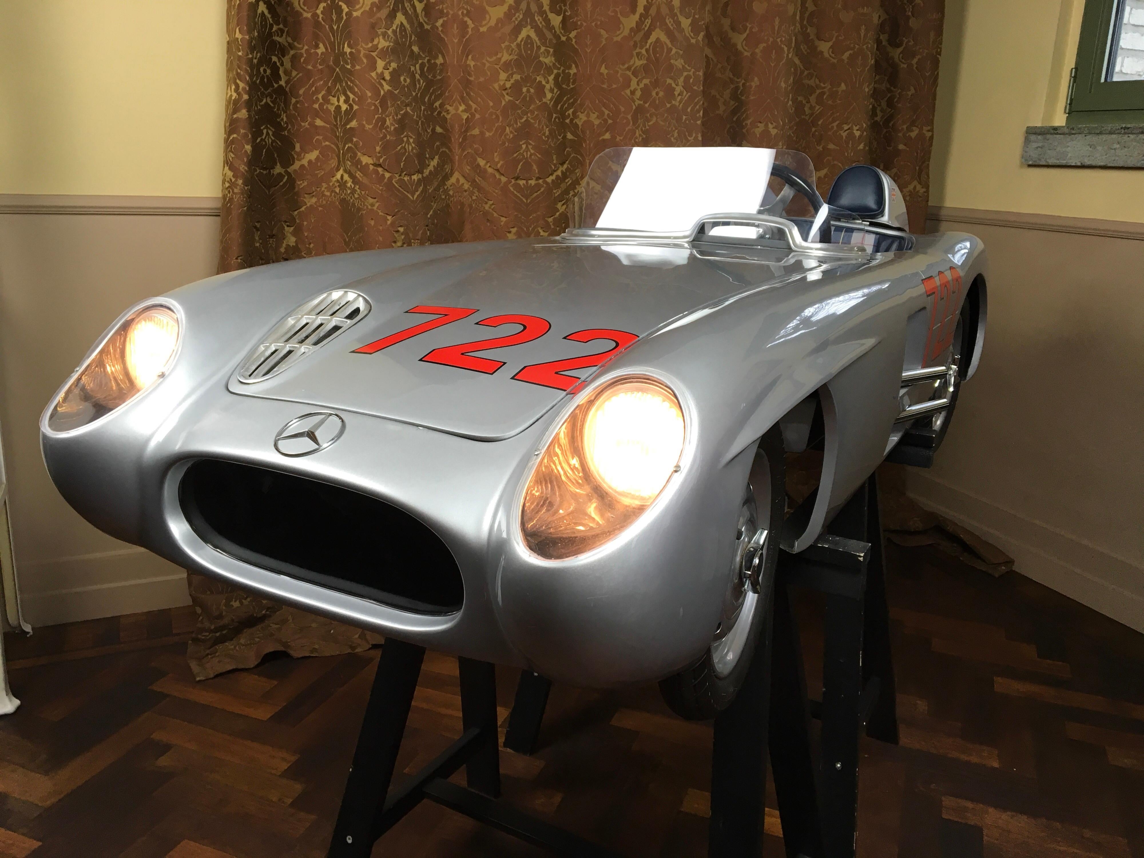Exceptional 1/2 Scale handmade Electric Mercedes-Benz 300 SLR Junior Car. 
This 722 Racer Half Scale Kids Car has number 004 / 005 and is signed by Sir Stirling Moss , the legendary Race Pilote that drove Victory in the 1955 Mille Miglia with this
