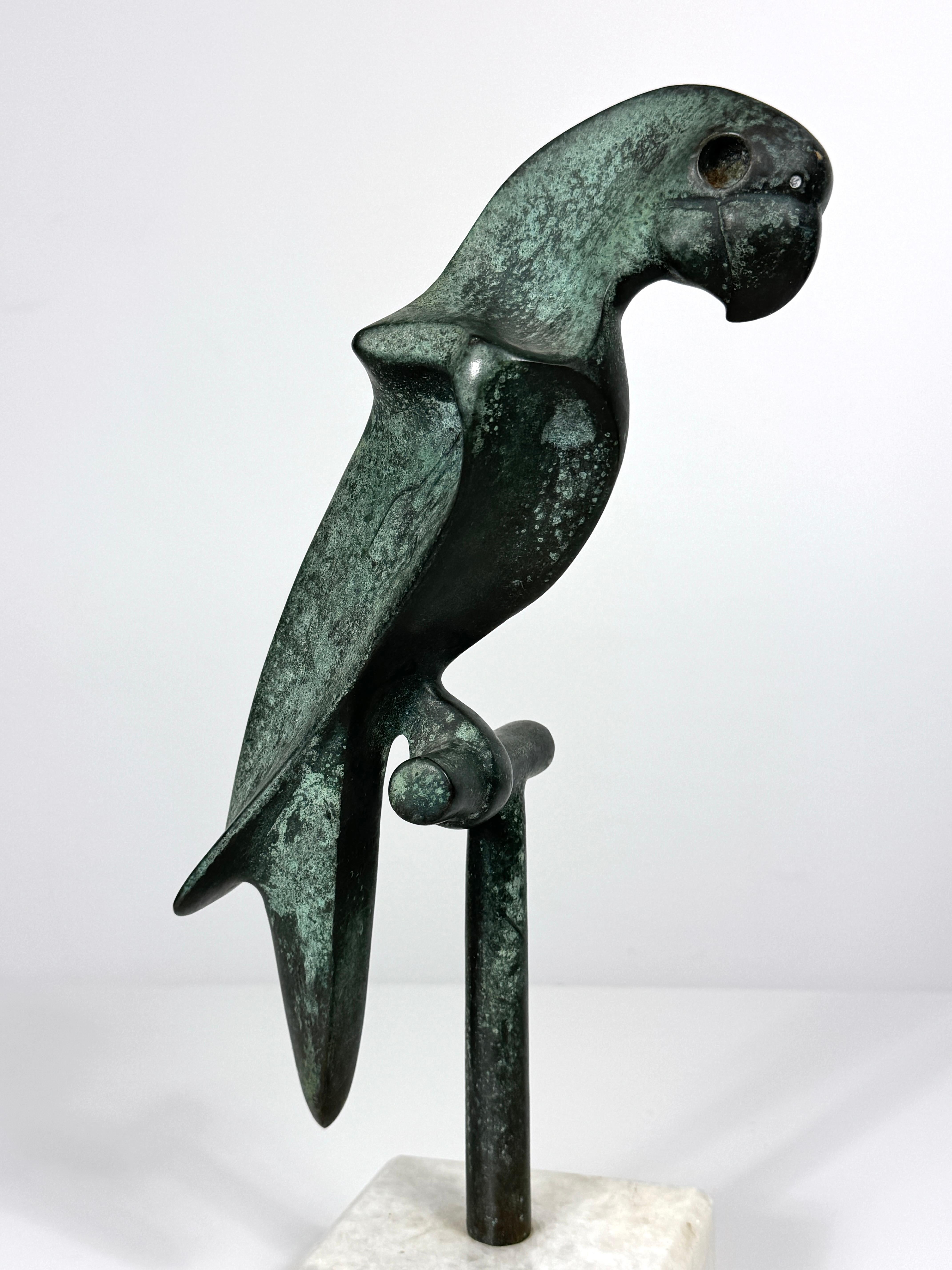 Modernist parrot sculpture by Hattakitkosol Somchai circa 1970s
Solid bronze parrot on perch with verdigris finish mounted to white marble base
Signed and numbered

5.5 inch width
5 inch depth
14 inch height