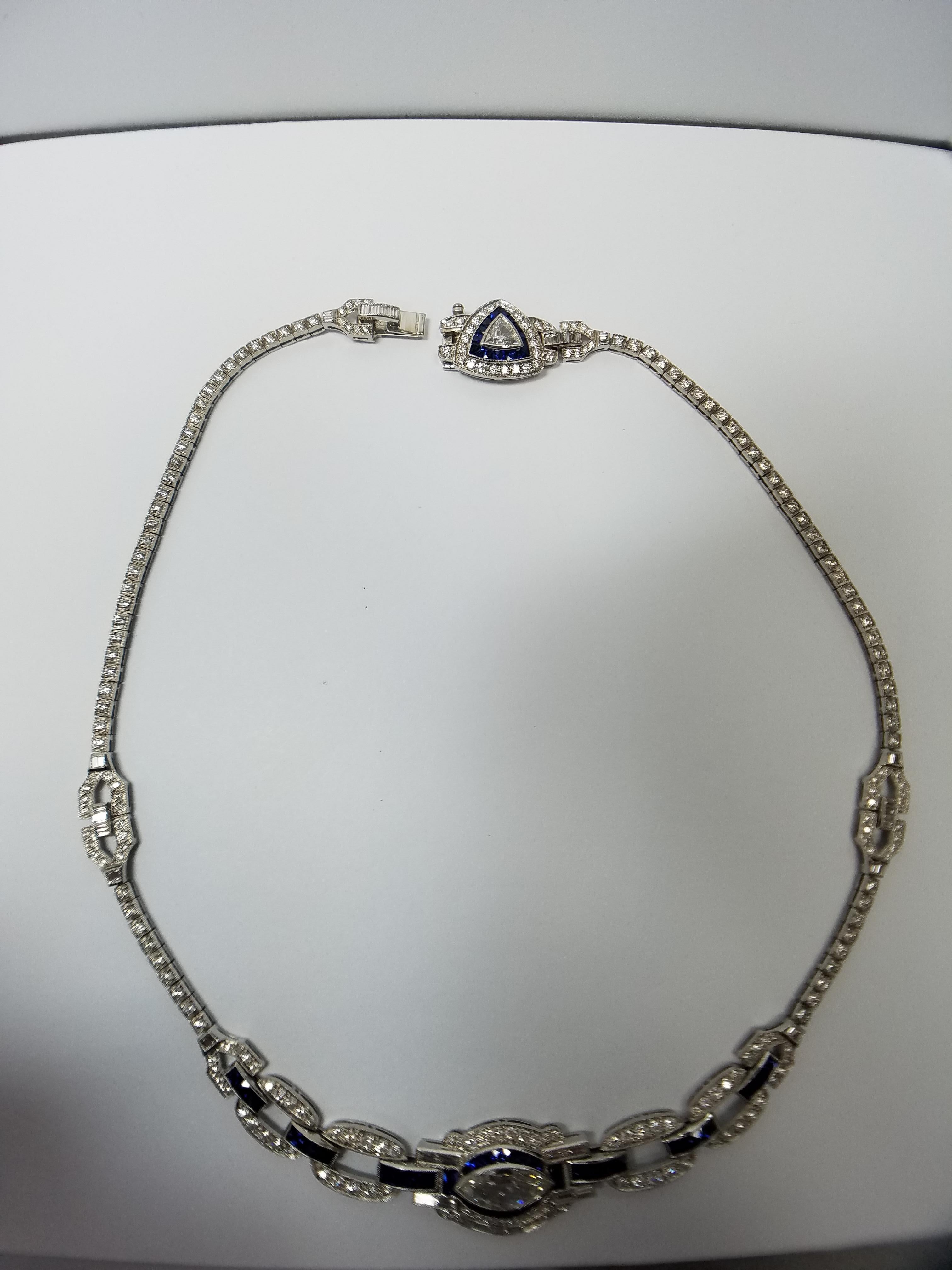 Platinum Necklace created by Sophia D. Marquise Shaped Diamond center stone weighing aprox 1.80 carats. Trillion center stone weighing aprox. 1.00 carats. Aprox 12 carat of diamond side stones and aprox 1.85 carat of french cut sapphire side stones. 