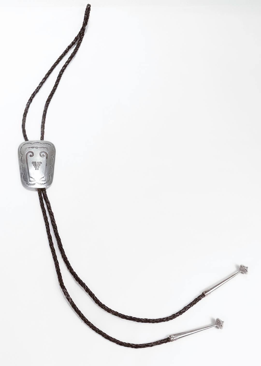 Signed Southwestern Silver & Leather Bolo Tie In Good Condition For Sale In Philadelphia, PA