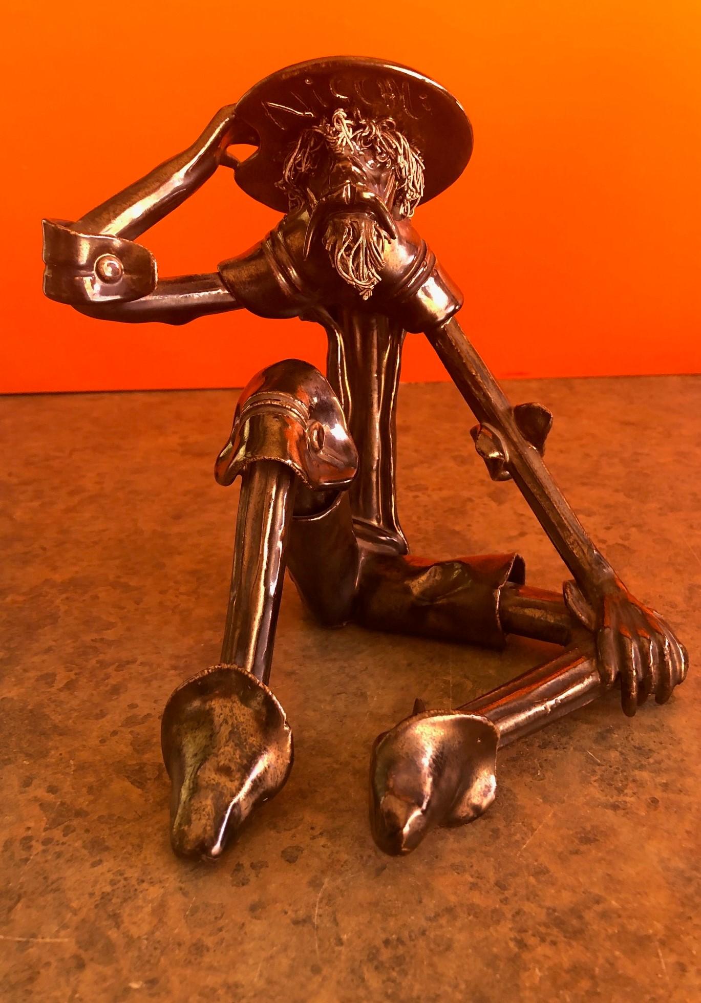 This is a vintage spaghetti sculpture of Don Quixote by Roberto Nischli, circa 1970s. This handmade ceramic sculpture has a metallic painted bronze finish and a wonderful Brutalist look. The piece has a lot of character and charm and would be a