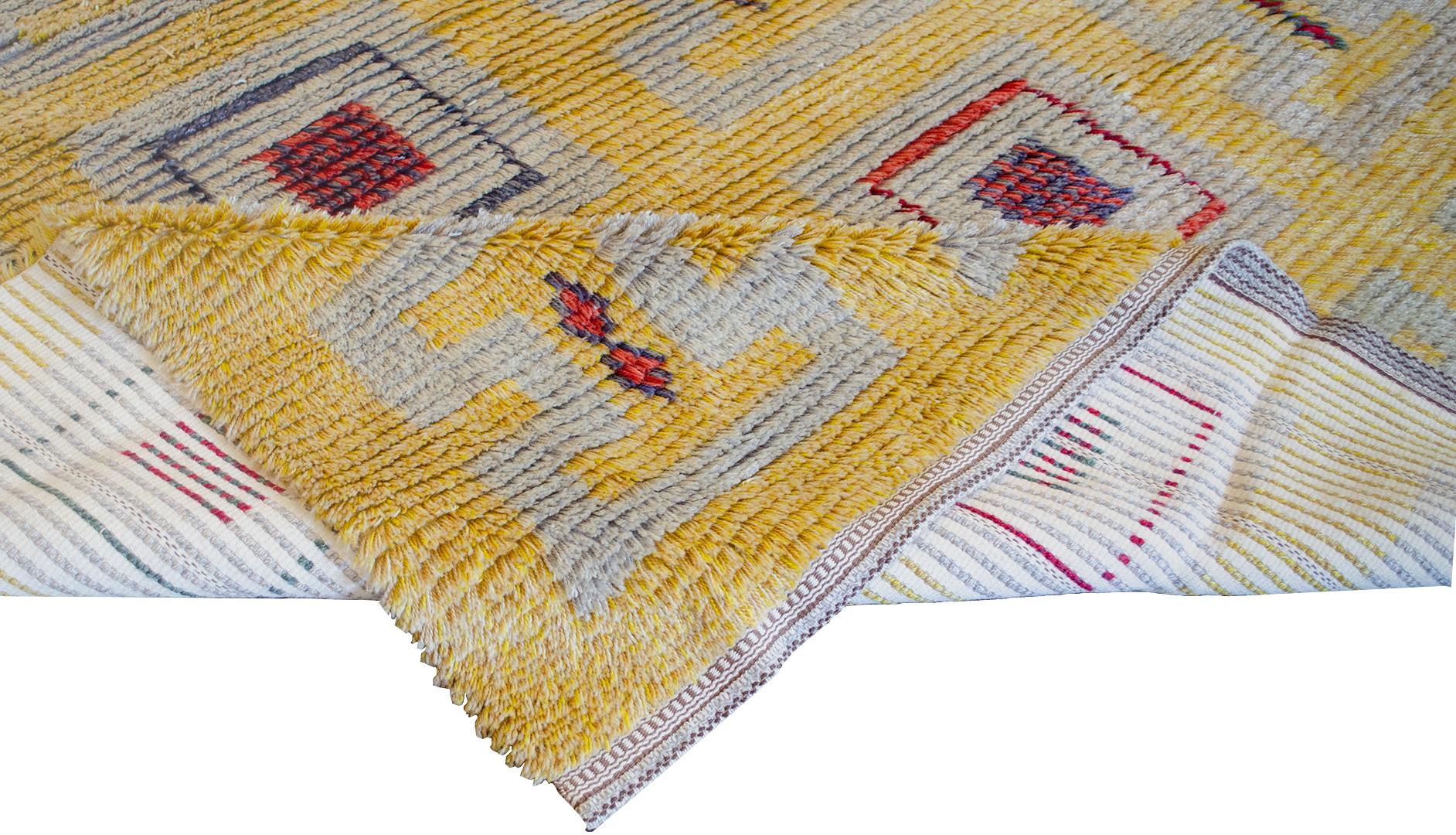 This traditional handwoven wool midcentury Swedish deco pile rug has alternating rows of checkered geometric pendants on a butter yellow field. Signed by the weaver/design studio.