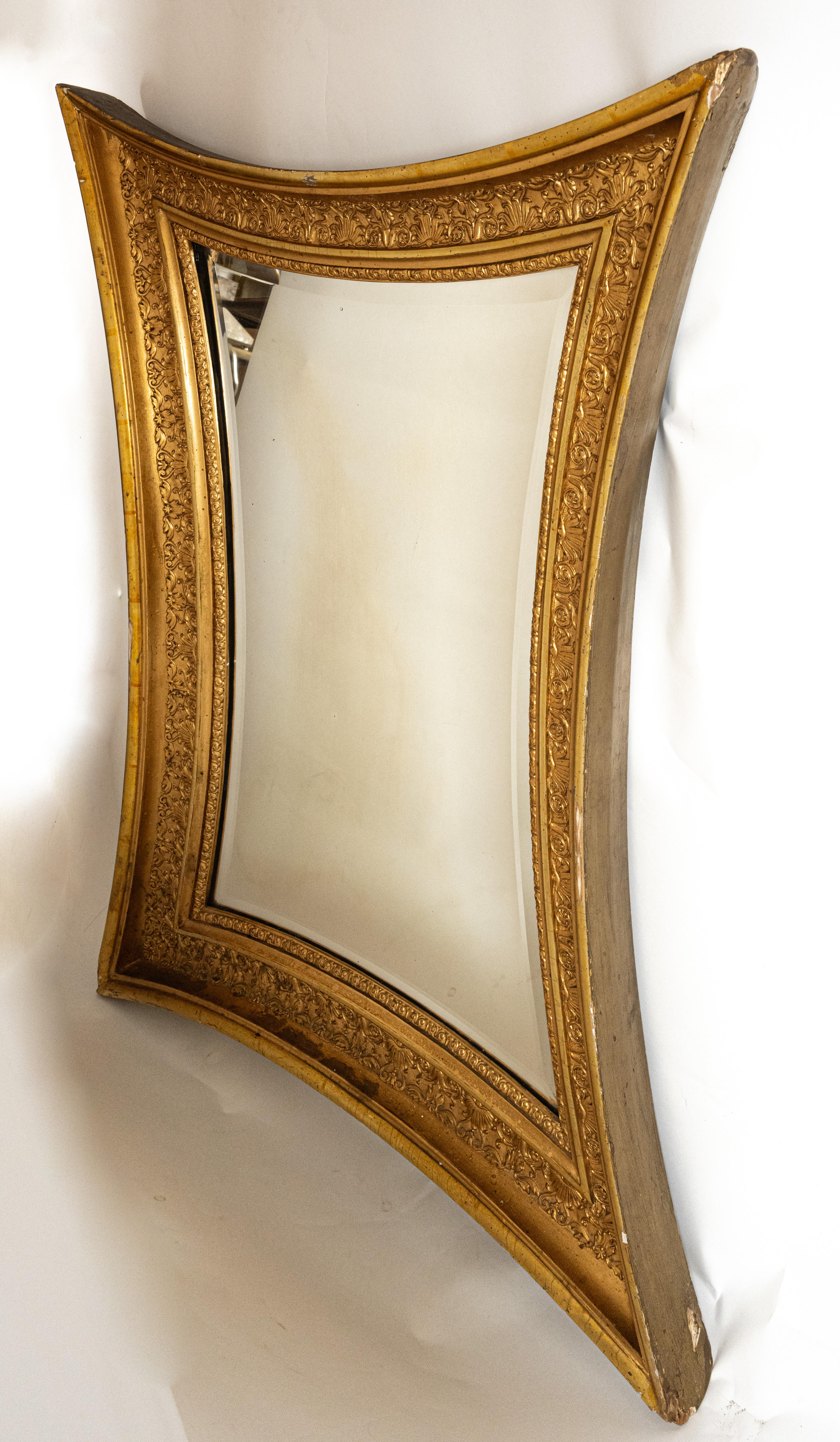 Swedish Karl-Johan period mirror. The carved giltwood gesso frame having raised carved details and antique beveled glass. Circa 1820s.

Signed by the maker. Partial label from Stockholmaker

Interior of frame measures 14-1/2in x 25in.