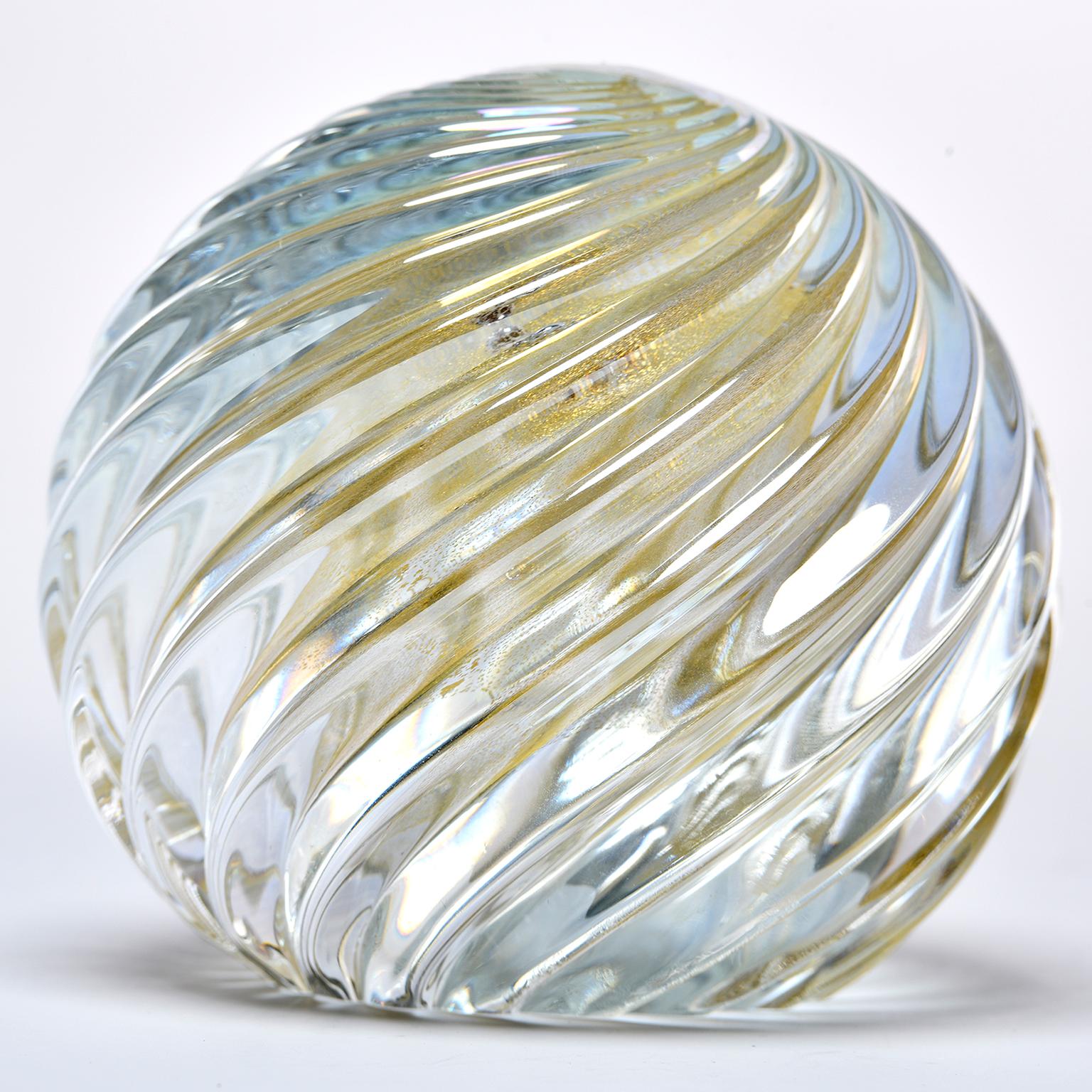 Seguso Murano glass paperweight is spherical clear glass with ridged surface and gold inclusions, circa 1980s. Two available. Sold and price separately.
  