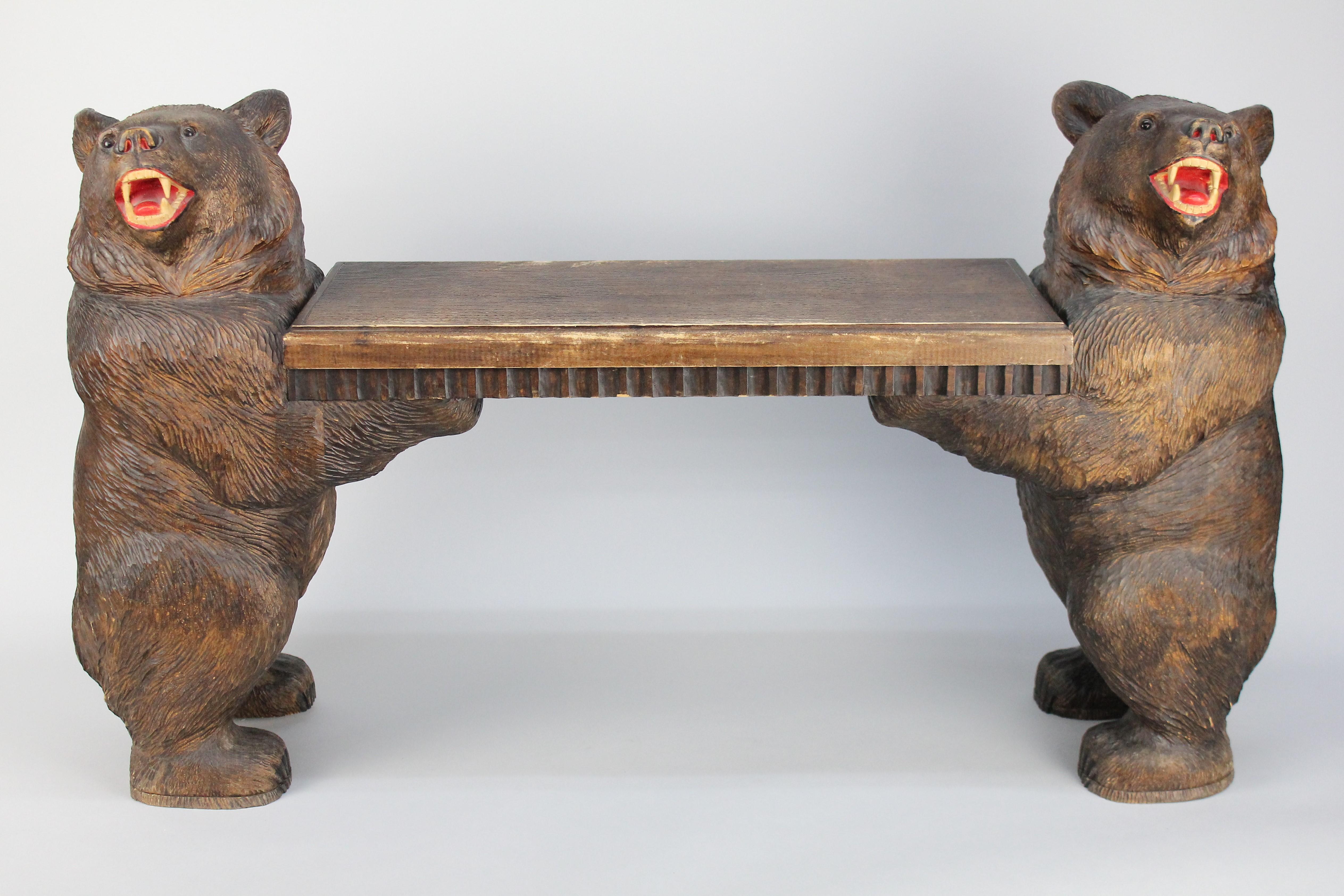 Wonderful Swiss Black Forest Bear stool or a small bench.
Handcarved in linden wood (limewood).
Many of these benches are fitted with a music box.
This is also prepared for a music box but there has never been one installed.
Great condition, no