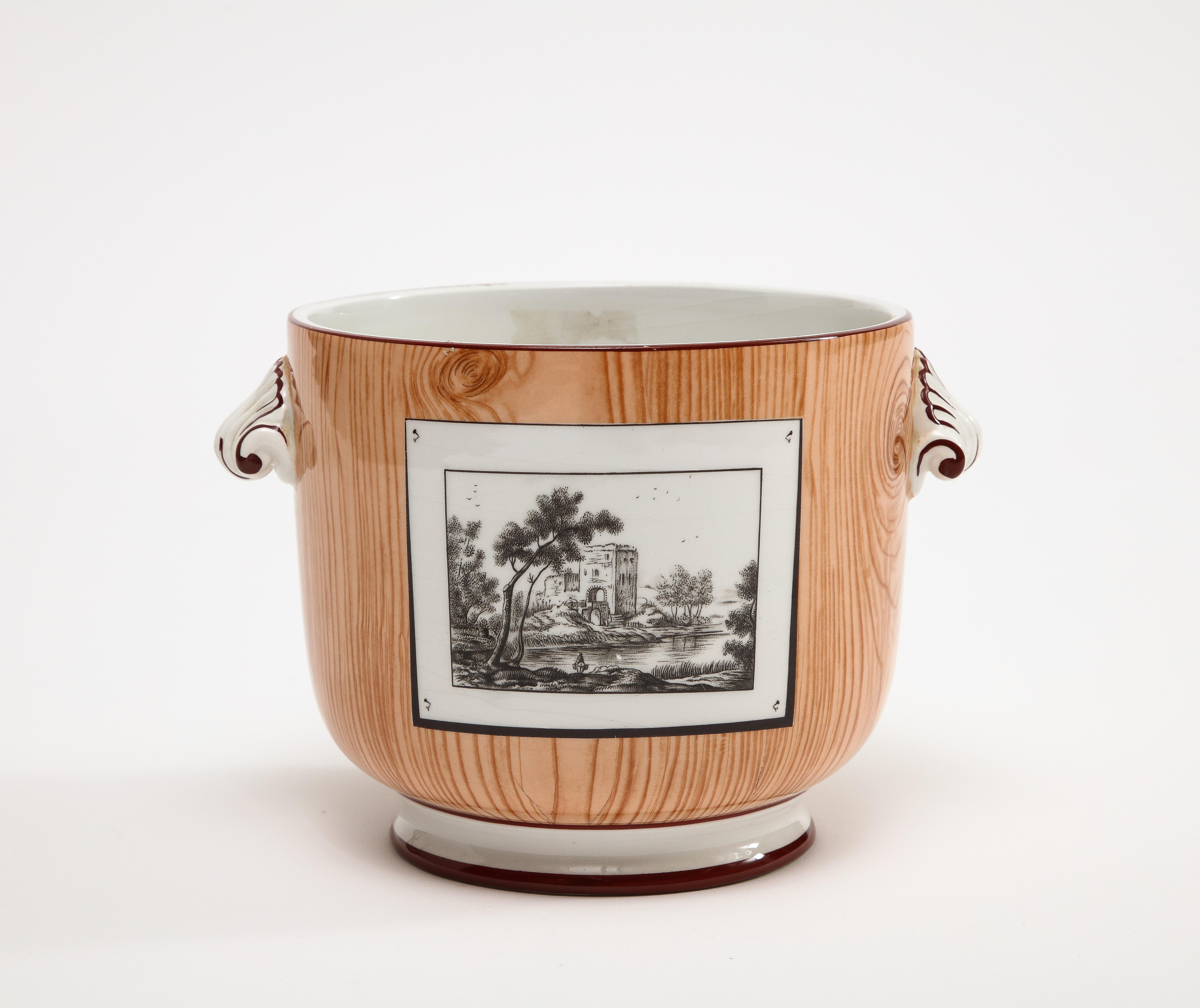 Signed Tiffany & Co. hand-painted scenic cache pot planter with applied shell handles, circa 1950s, made in Italy. The pot is painted with a wood grain and knot pattern with black & white postcard pictures of Italian scenery. 

Additional Dimensions