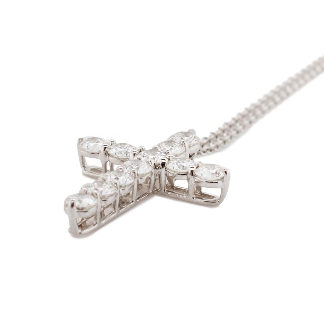 One lady's designer made polished platinum single strand matinee, diamond fancy link necklace. The necklace measures approximately 16.00mm in length by 21.15mm tapering to 15.40mm in width and weighs a total of 3.63 grams. Engraved with 