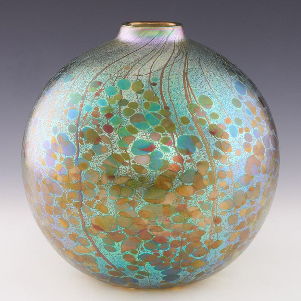 Heading : Signed Timothy Harris Isle of Wight 'Summer Fruits Greenberry' ball vase
Date : c2005
Origin : Isle of Wight
Bowl Features : Iridescent green glass ball vase depicting summer fruits and berries
Marks : Signed Timothy Harris to base
Type :