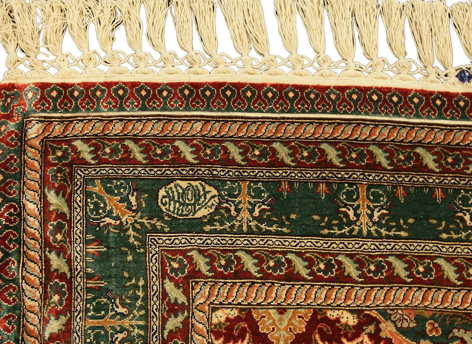 This is an extremely fine all silk and metal threaded Hereke rug woven in Turkey during the beginning of the 21st century circa 2000 – 2010 and measures 121x86 cm in size. It has an all-over design with repeating medallions surrounded by different