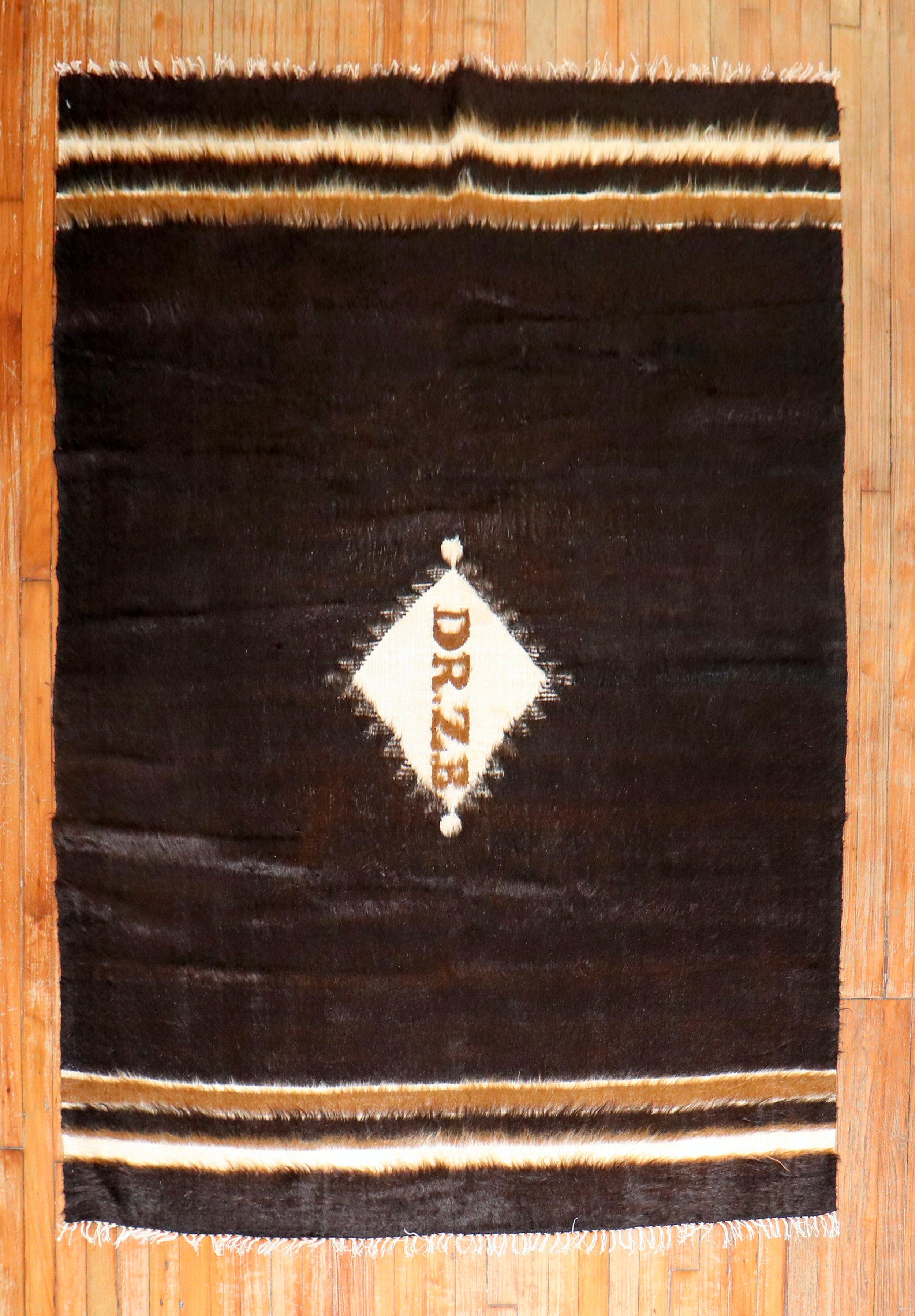 Vintage Angora mohair wool rug in black and ivory. Medallion Signed Dr. ZB. probably given as a dowry gift

Measures: 4'10'' x 5'8''.