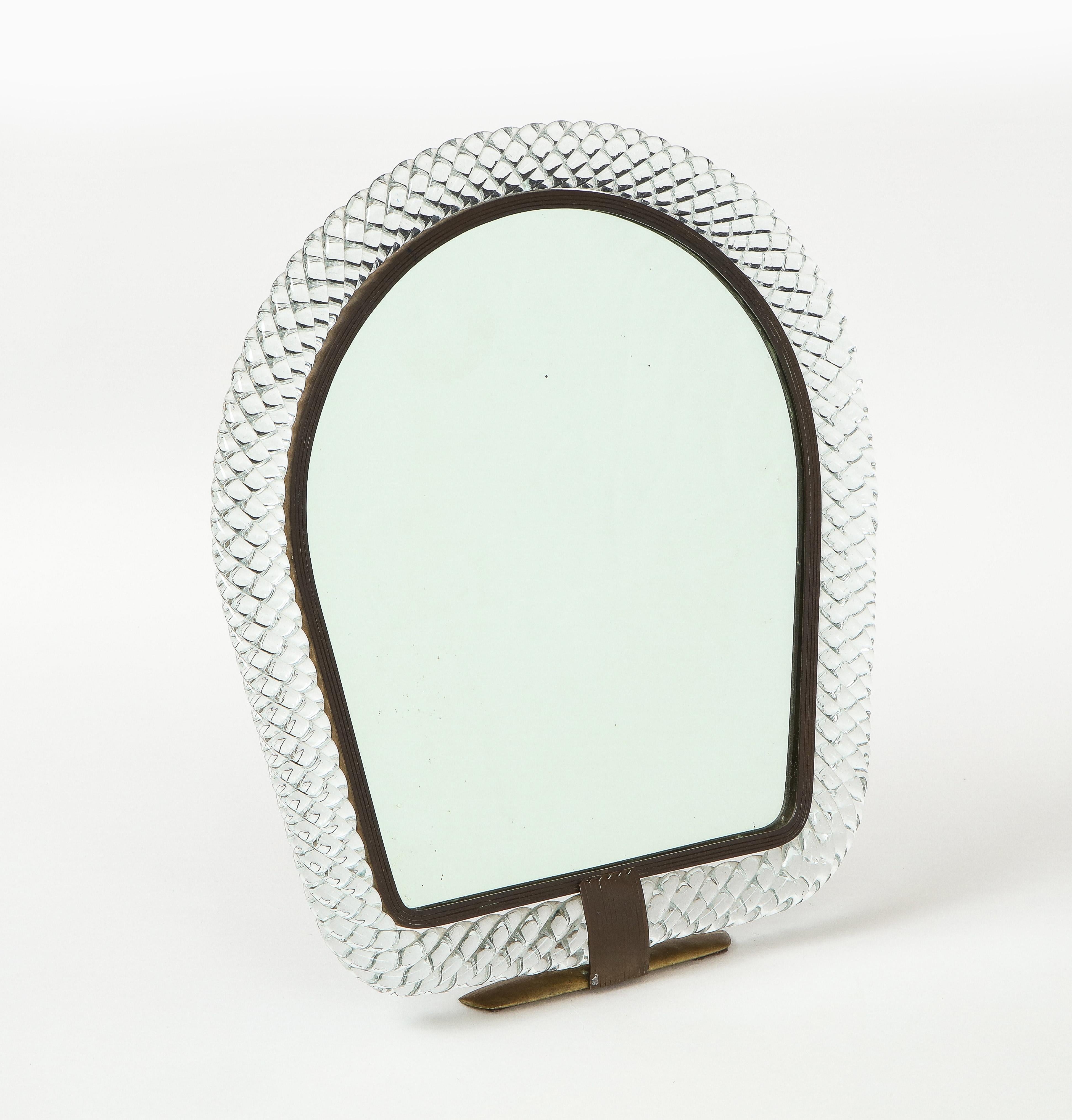 Rare exquisite Carlo Scarpa for Venini table or vanity mirror composed of arched top with braided clear blown glass with brass inner frame and mounts, original mirrored glass and wood backing, Italy, 1930s. This vanity or dressing mirror was made