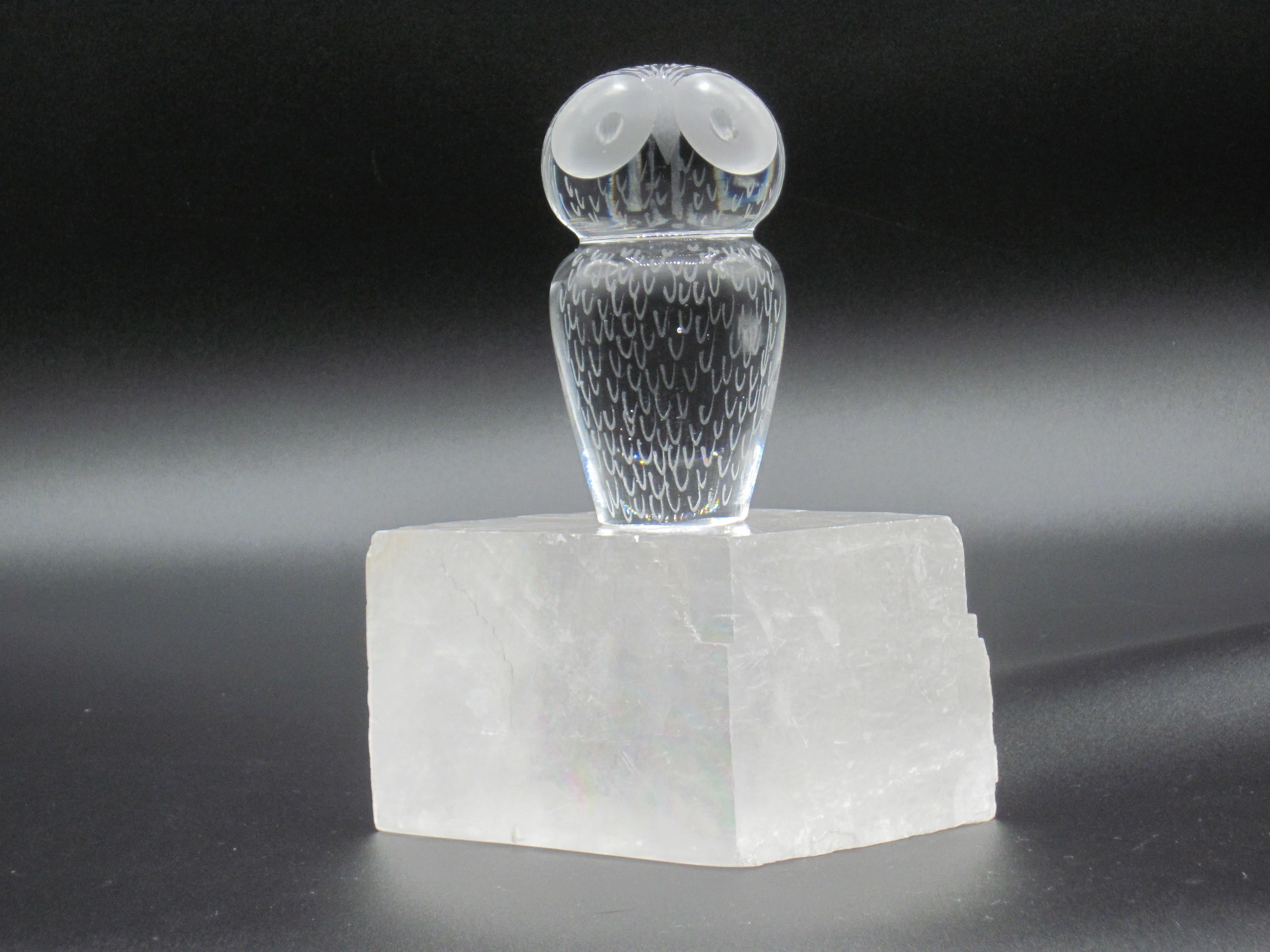 A Kosta crystal paperwieght by Vicke Lindstrand with etched eyes and feathers on head and front side of body. Underside is signed Kosta 92458 Lindstrand.

Elis Berg started as a designer and became the artistic director at Kosta. In 1950 he left