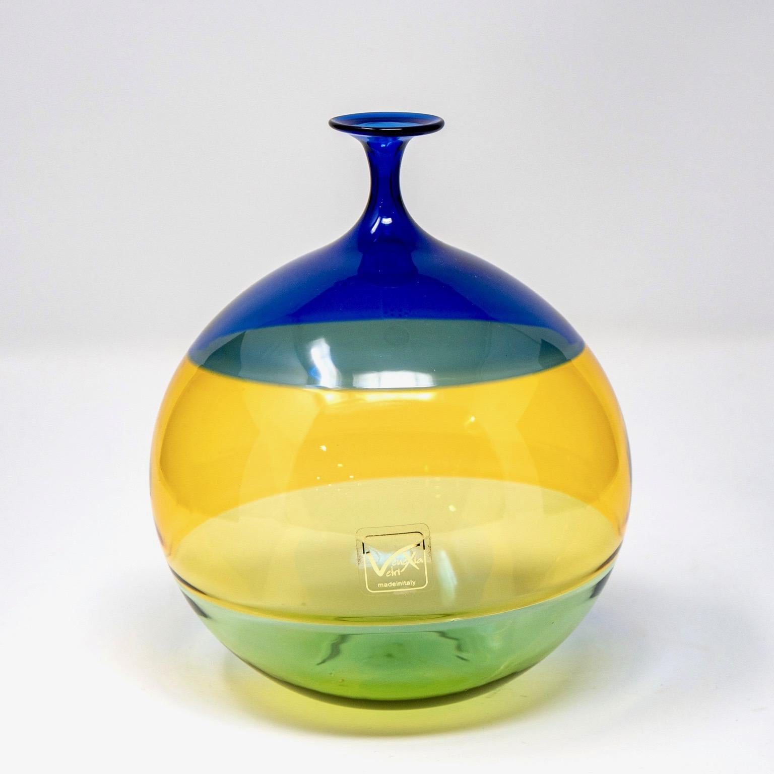 Medium sized globe shaped Murano glass vase signed by Vinciprova features a narrow neck and color block body with deep blue, yellow and green, circa 1980s. Original label affixed. Excellent vintage condition with no flaws found.